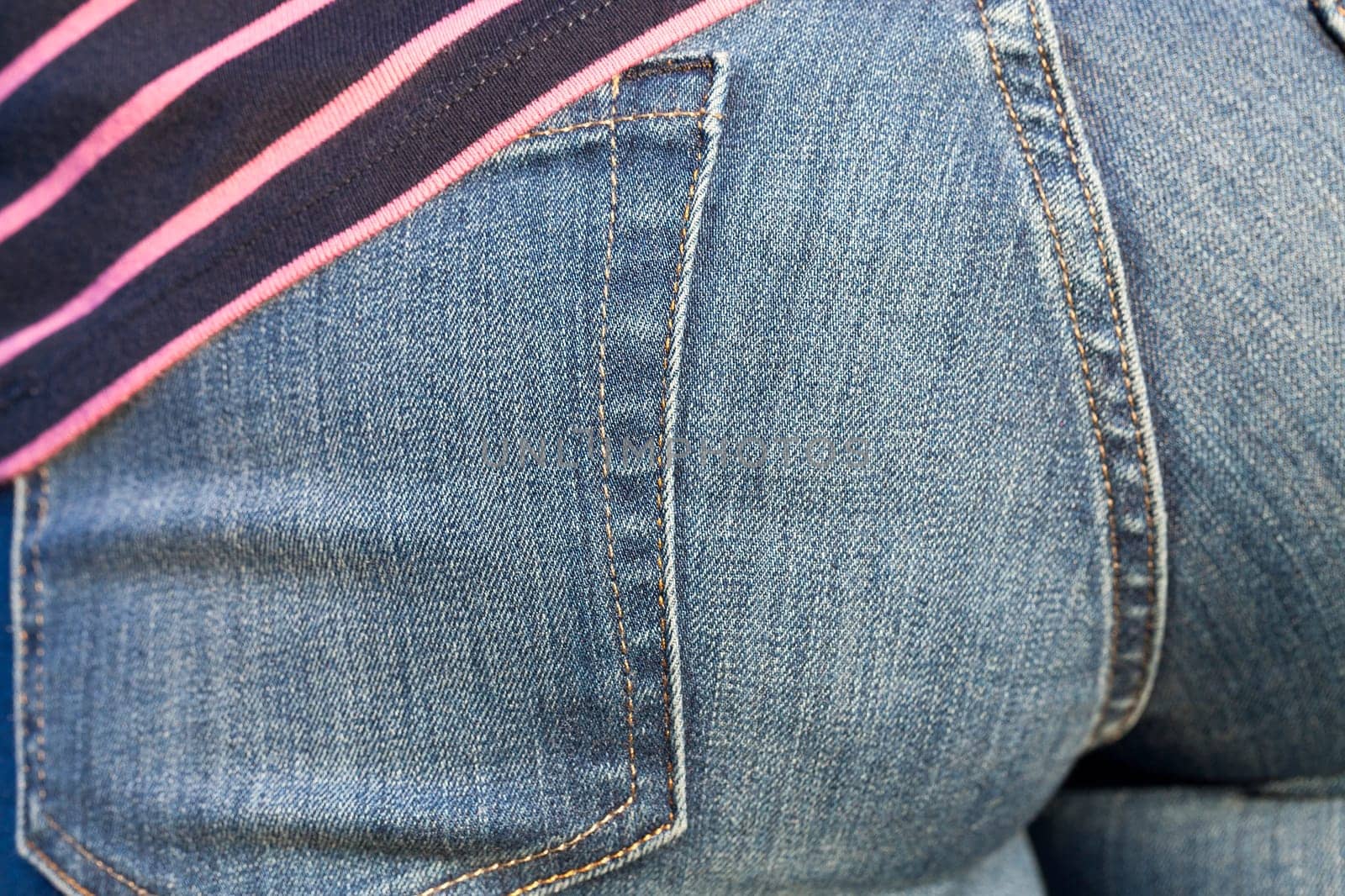 blue jeans wearing a girl picture rear side of the back, close-up