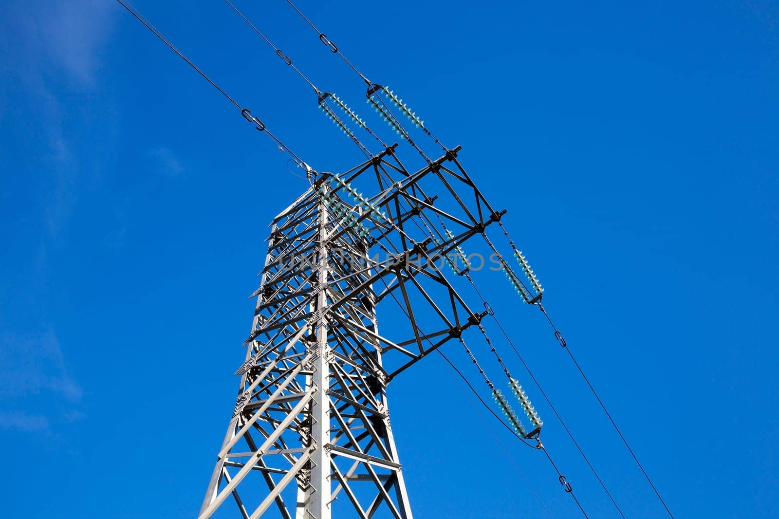 photographed close-up, high-voltage electric poles located in the countryside