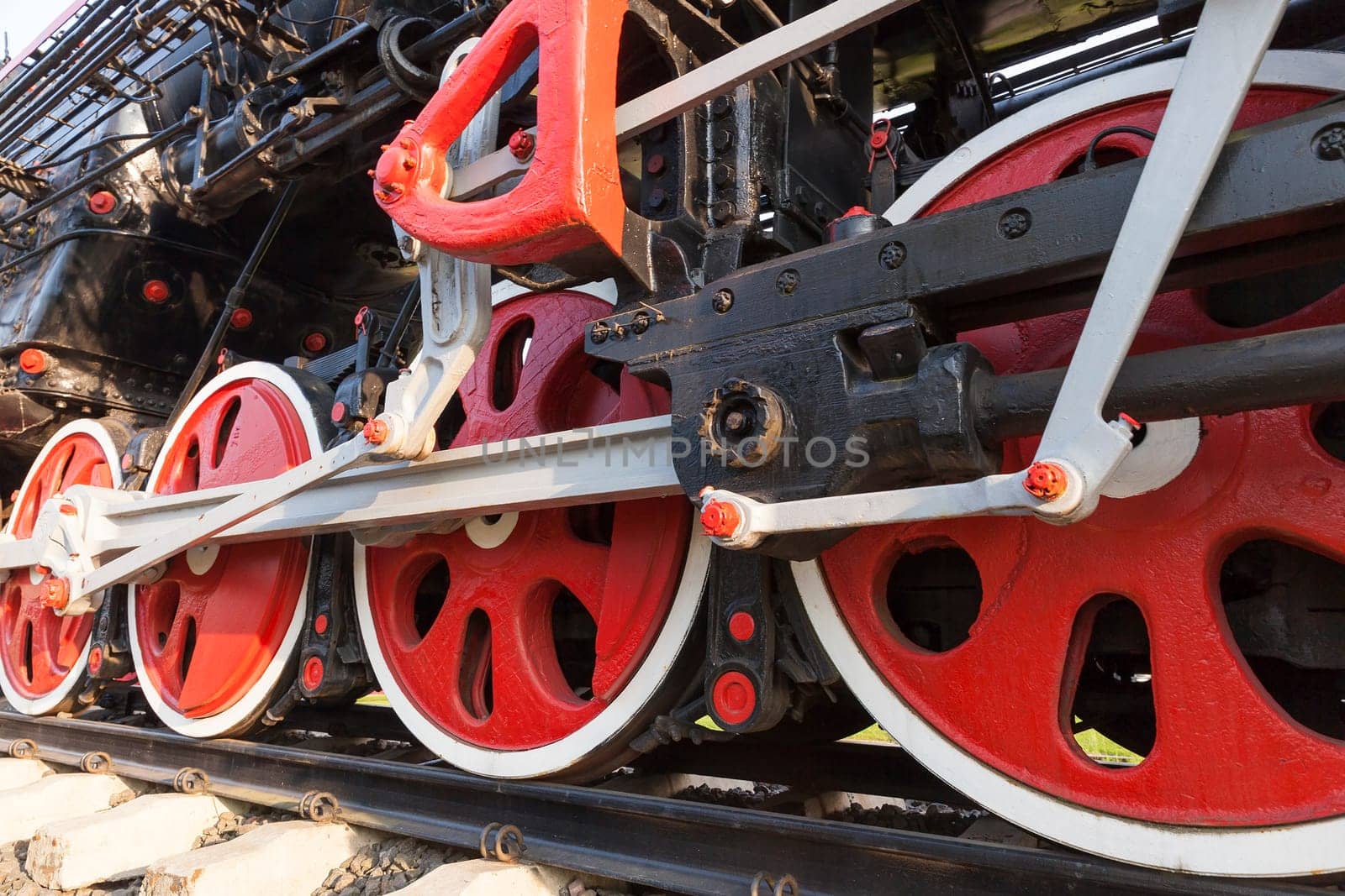 photographed close-up of an old steam locomotive black and red colors