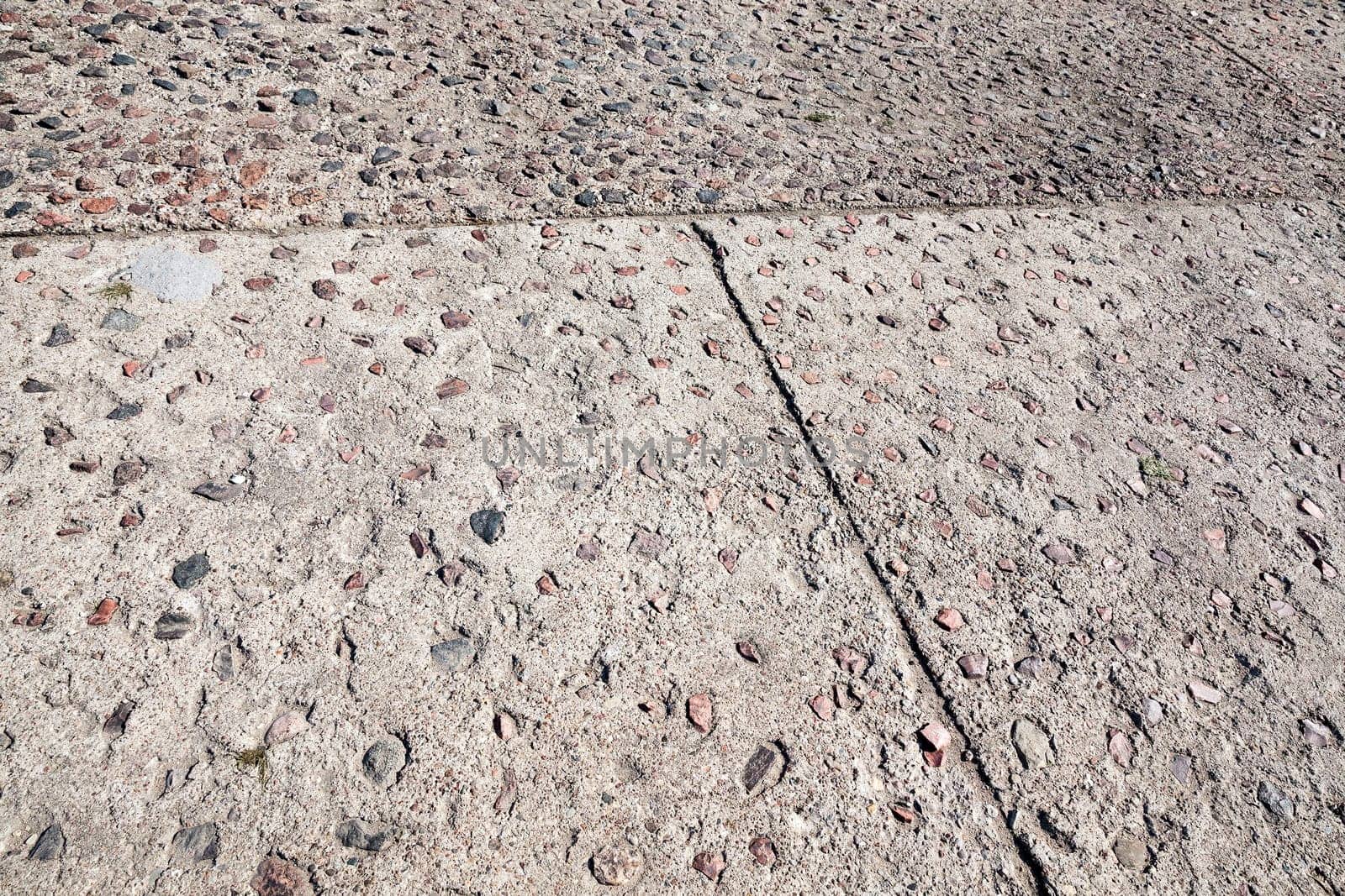photographed close-up of the pedestrian road made of concrete tiles