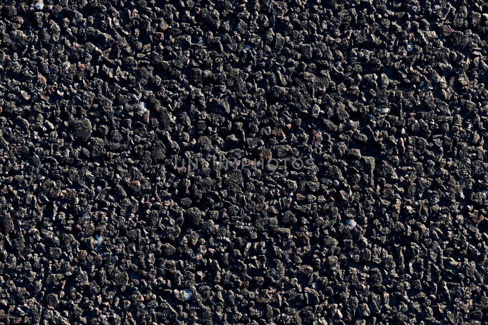 photographed close-up of the new road for the movement of vehicles, a dark cover the carriageway