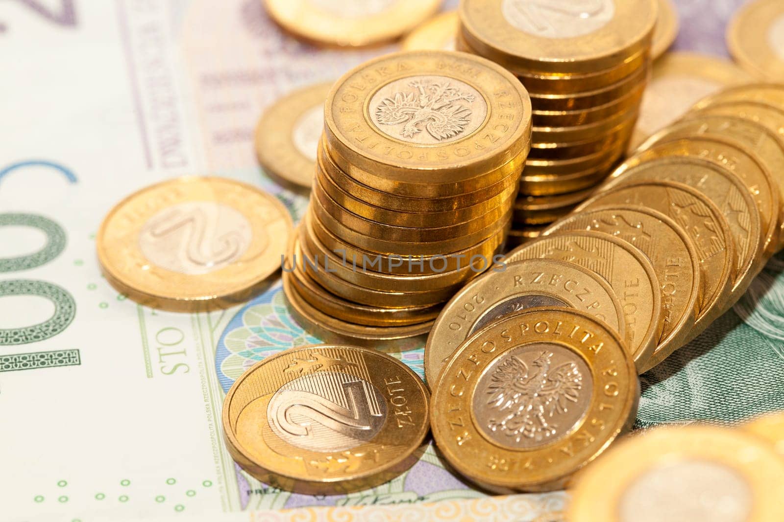 photographed close-up Polish coins. Zloty stacked together, shallow depth of field