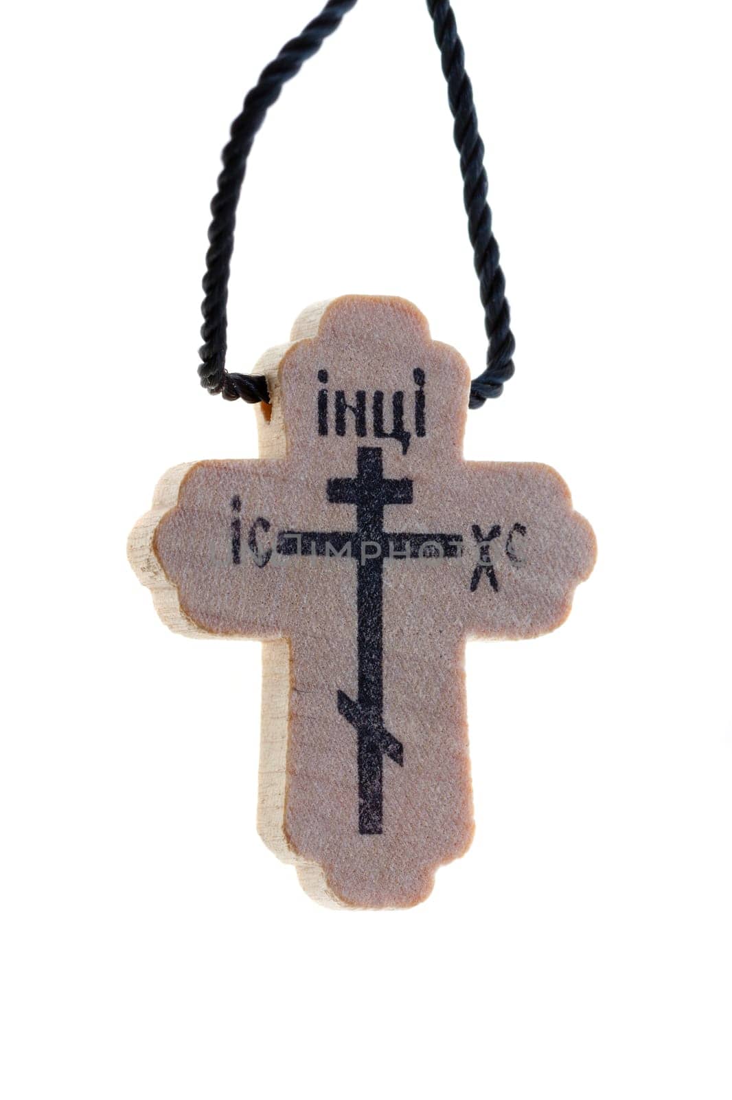 the old Orthodox wooden pectoral cross, isolated on white background. Photo closeup