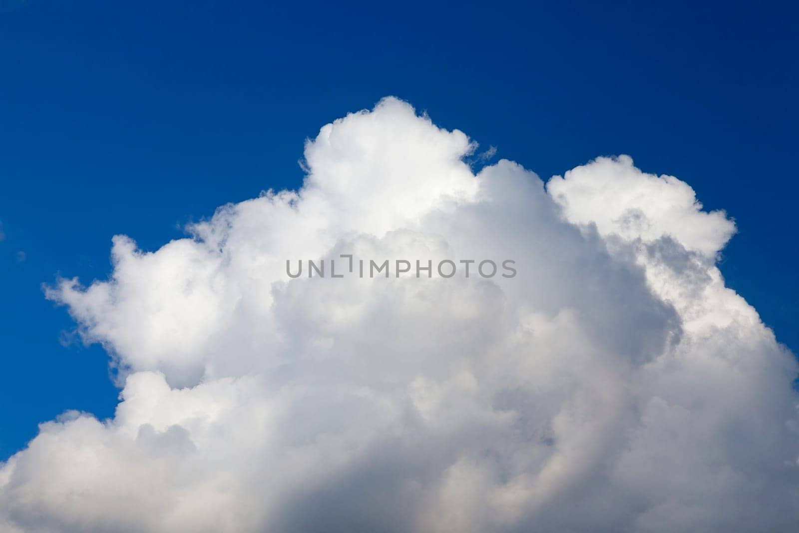 photographed close-up white clouds are in the blue sky, shallow depth of field