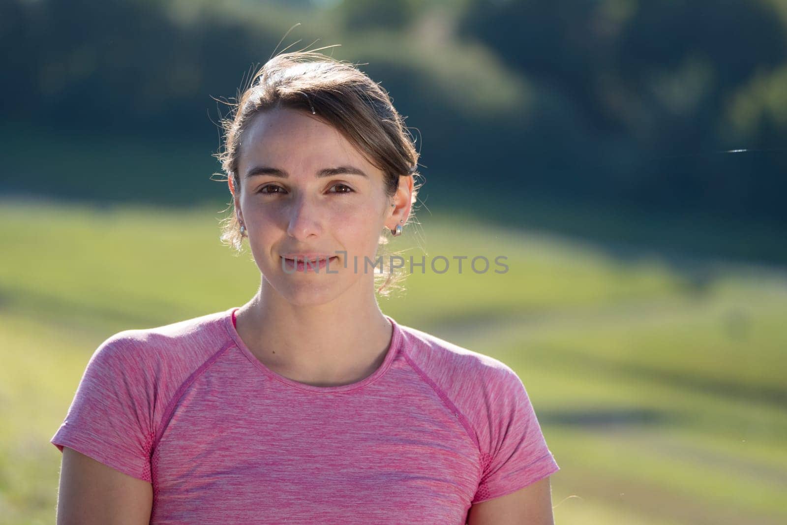 portrait of a young sporty woman in the countryside