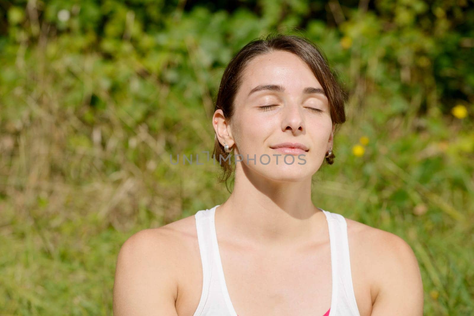 portrait of a young sporty woman in the countryside