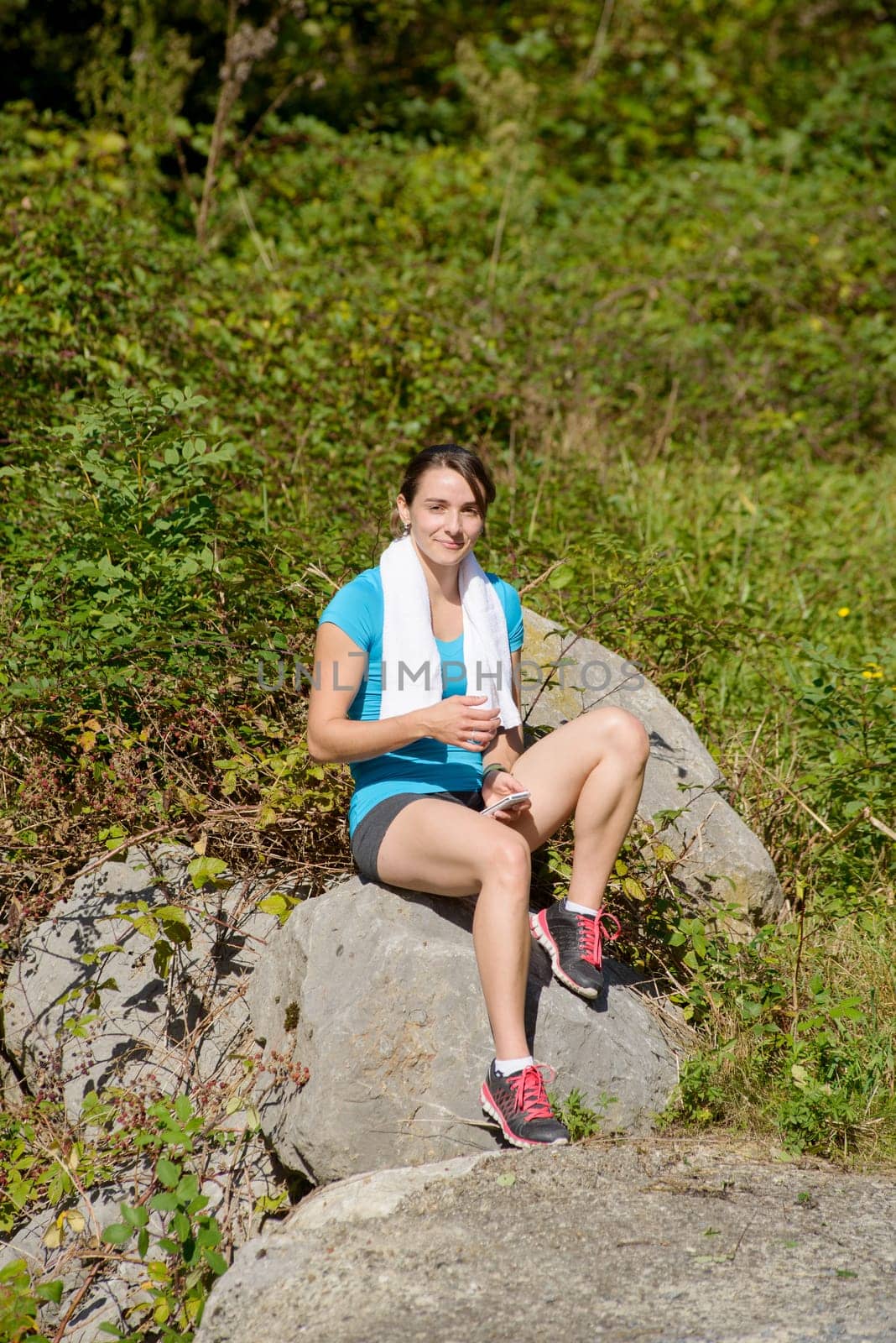 beautiful sporty young  woman relaxing after exercising