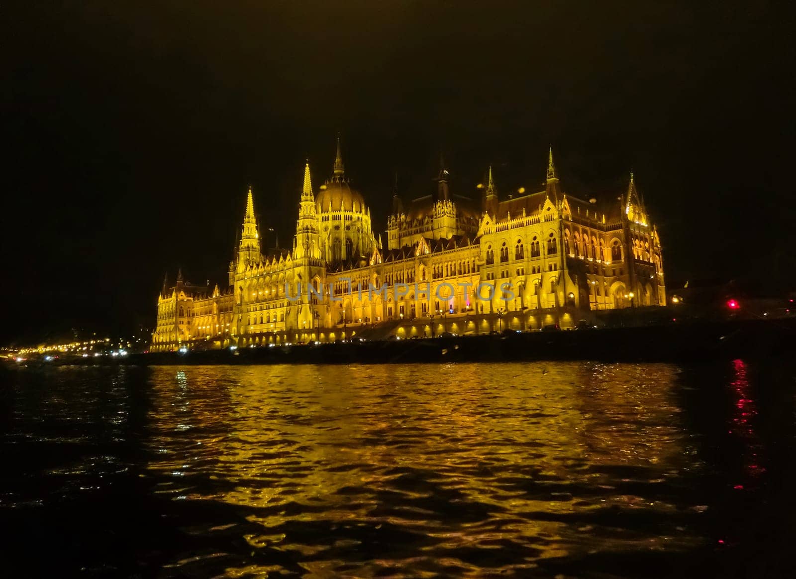 Budapest Parliament in Hungary at night on the Danube river