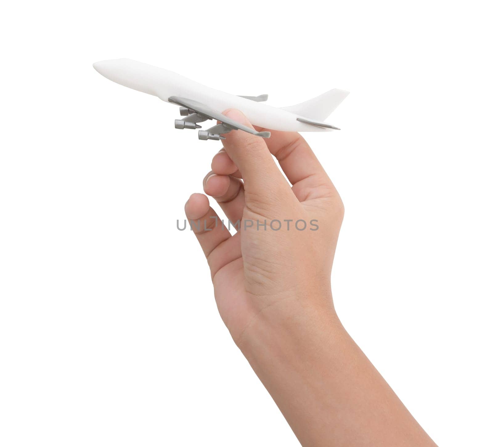 hand holding airplane toy model isolated on white background