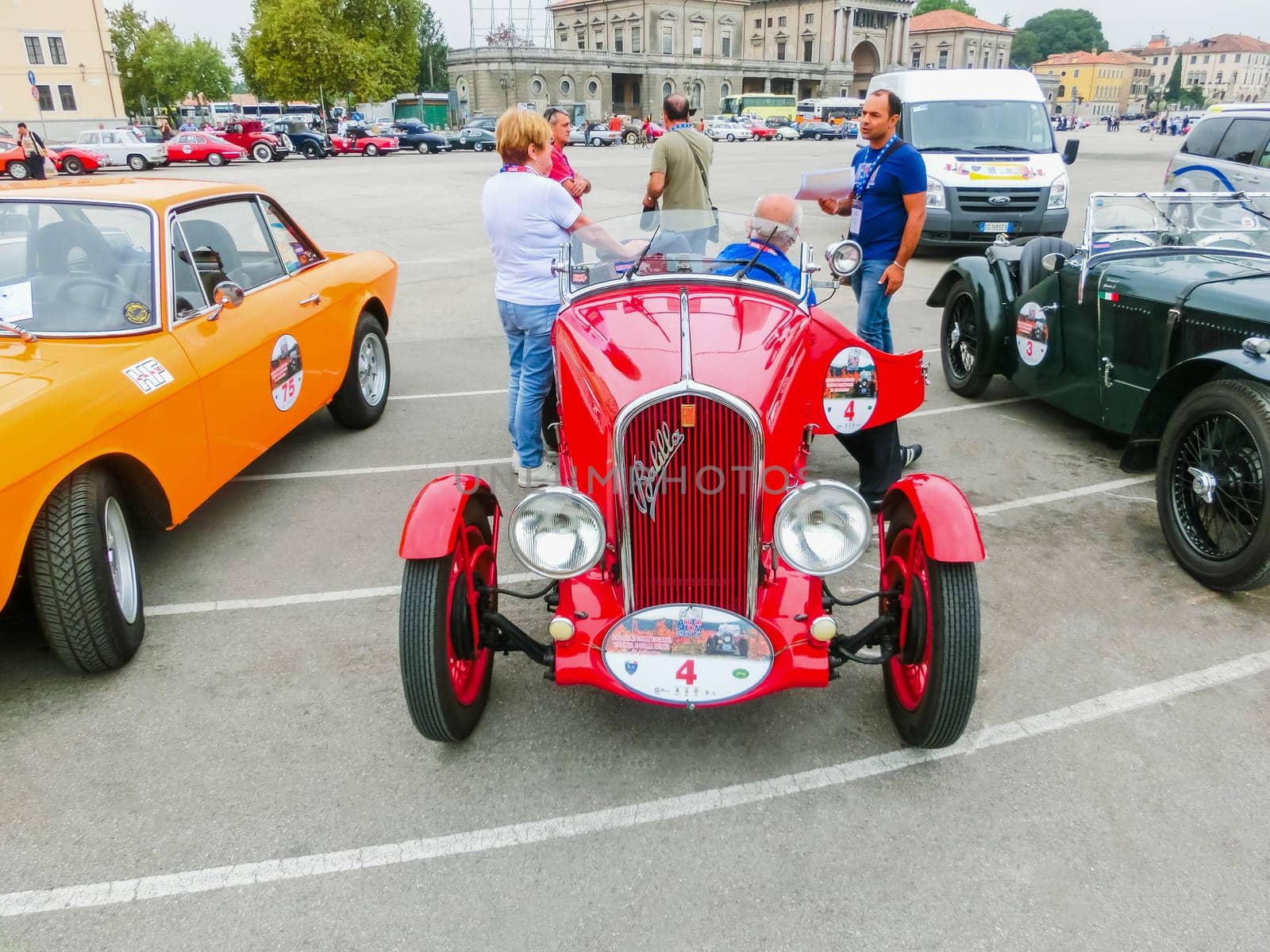 Padua, Italy - September 19, 2014: Benefit Antique Classic Car Show: People are the members and sitting at the car at Benefit Antique Classic Car Show at Padua at September 19, 2014. Cars and enthusiasts from all over Italy.