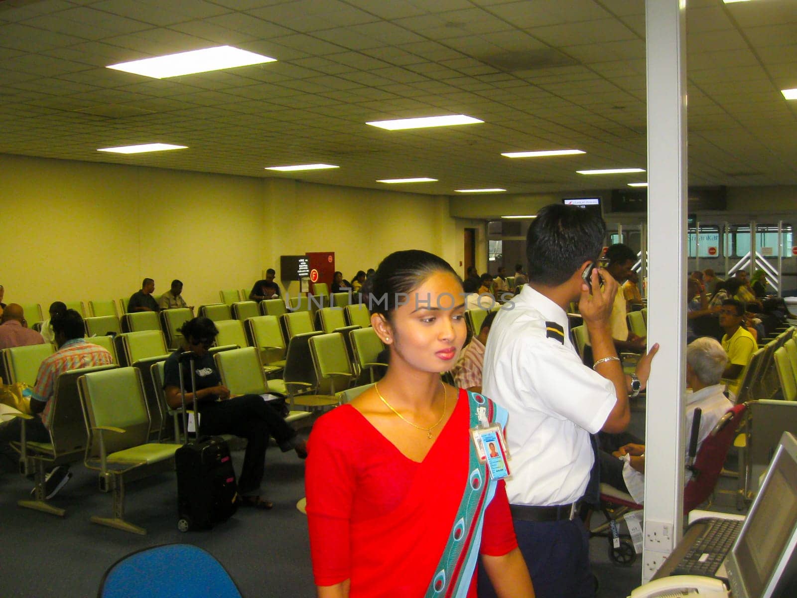 Colombo, Sri Lanka - May 05, 2009: The Young beautiful flight attendant in the Transit area at Bandaranaike International Airport at Colombo, Sri Lanka at May 05, 2009