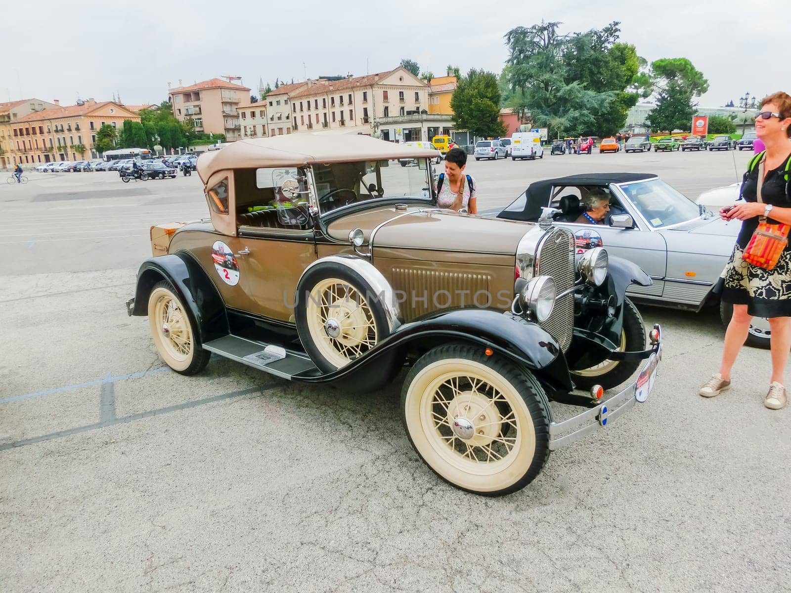 Padua, Italy - September 19, 2014: Benefit Antique Classic Car Show: People visiting Benefit Antique Classic Car Show at Padua at September 19, 2014. Cars and enthusiasts from all over Italy.
