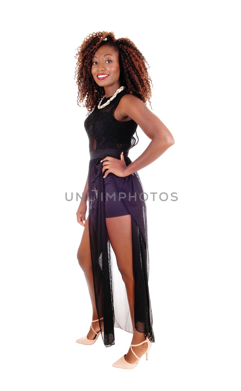 A lovely young African American woman standing in a black dress .isolated for white background..