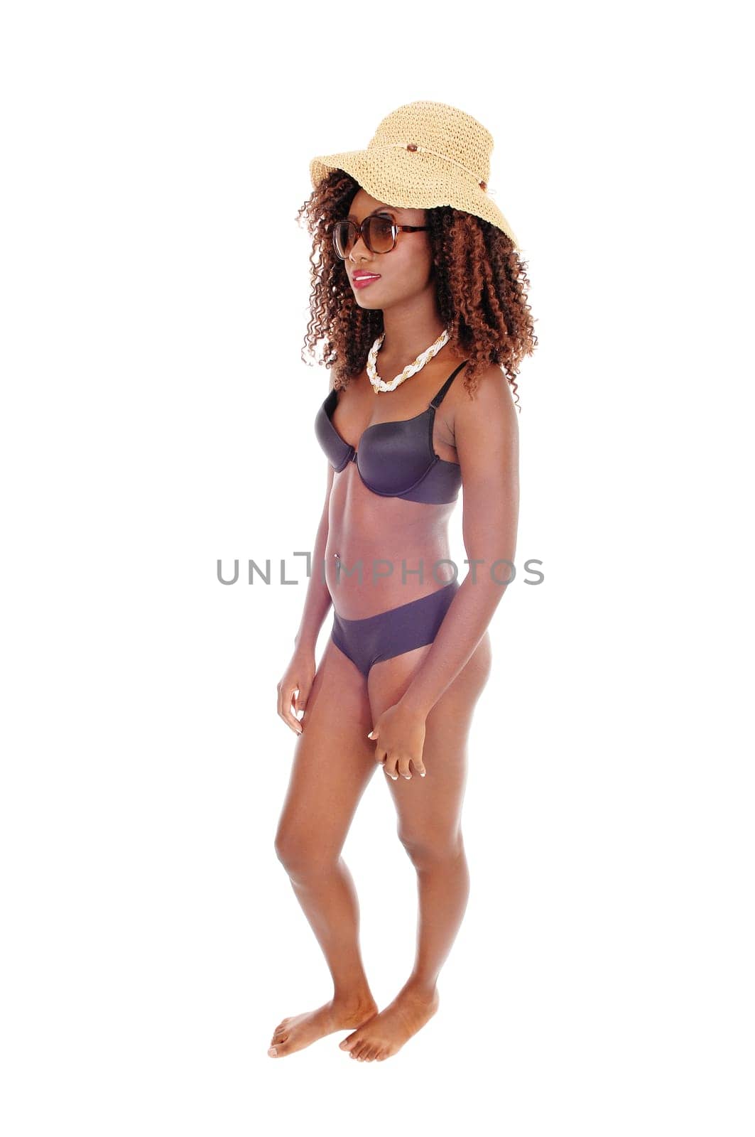 A image of beautiful and slim young African American .woman standing in black panties and bra, isolated for white background..
