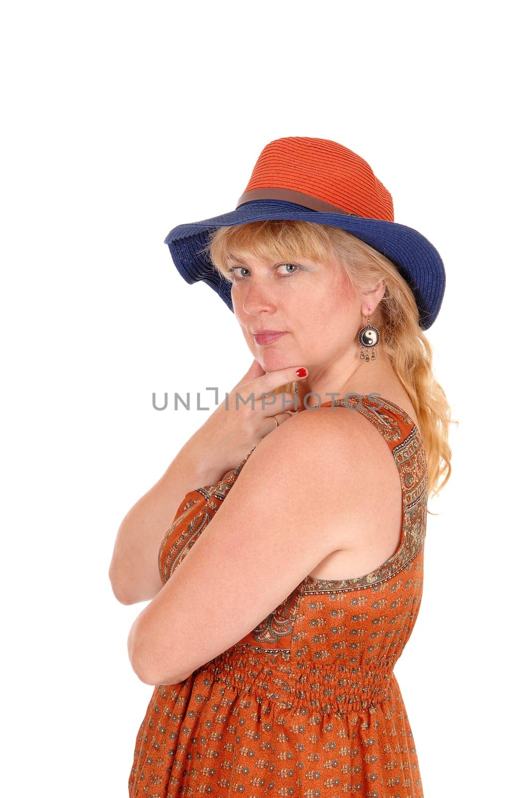 A portrait image of a pretty blond woman in a dress wearing a summer.hat, isolated for white background..