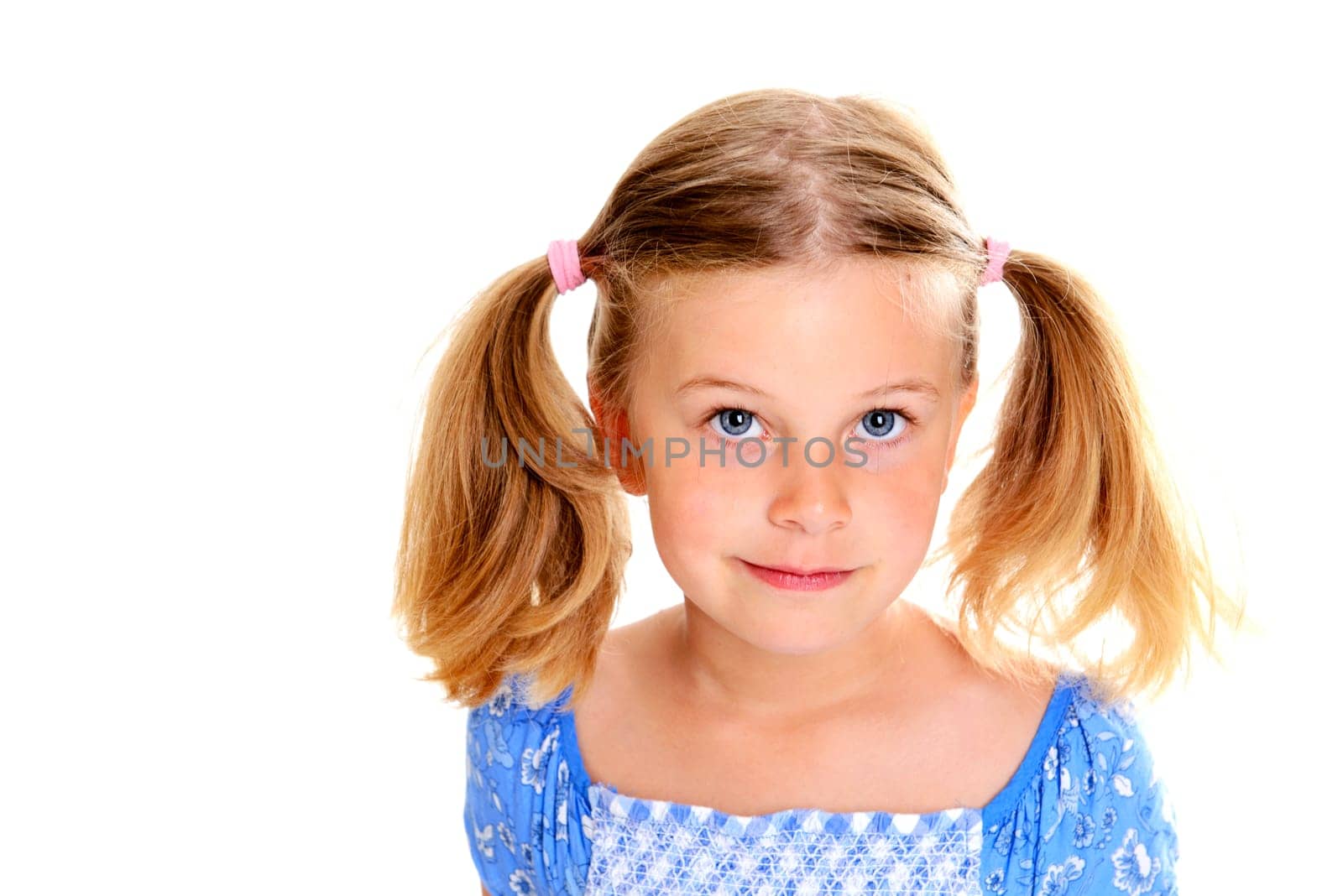 portrait of a little blond girl with pigtails