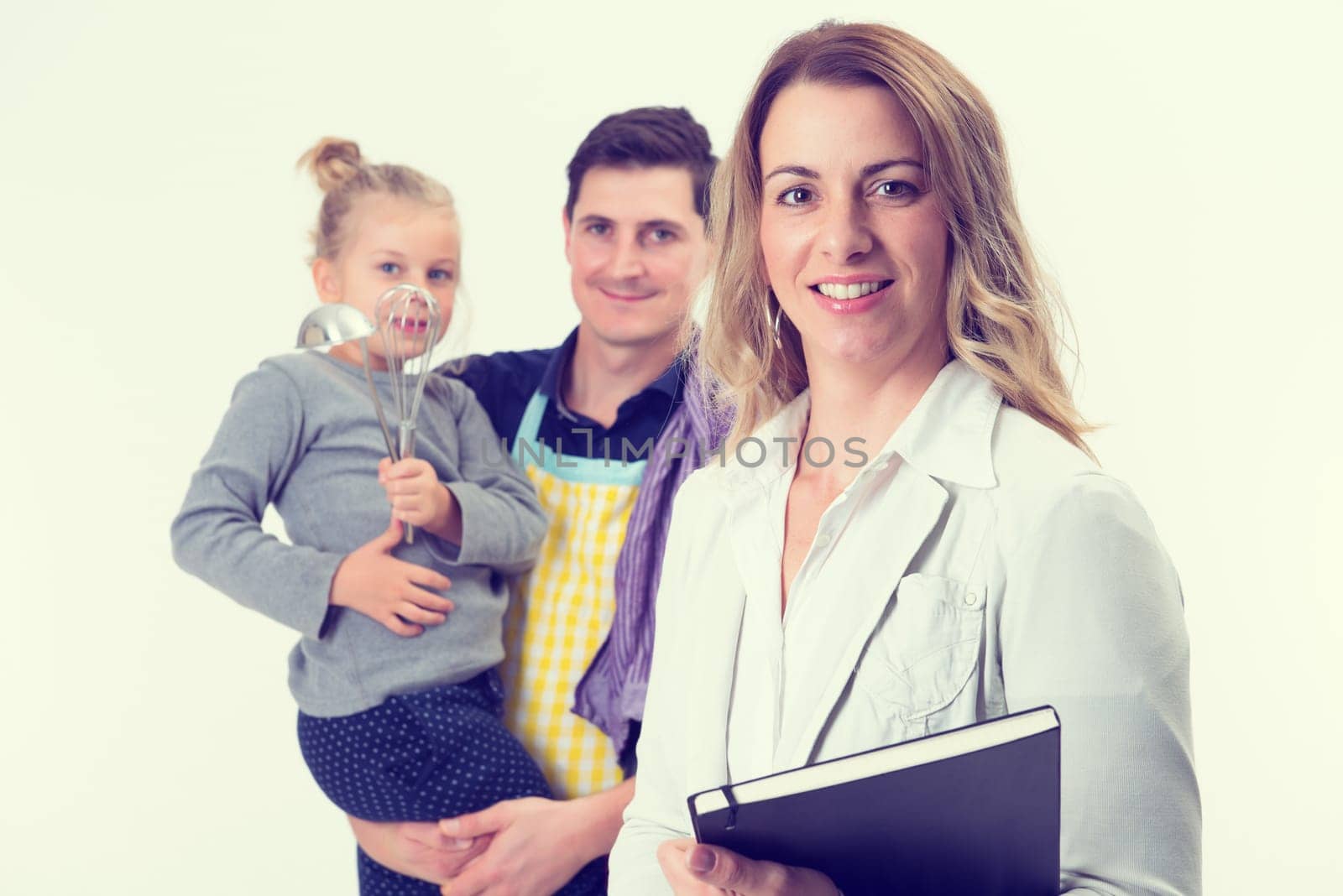 young beautiful businesswoman and her husband with child in background