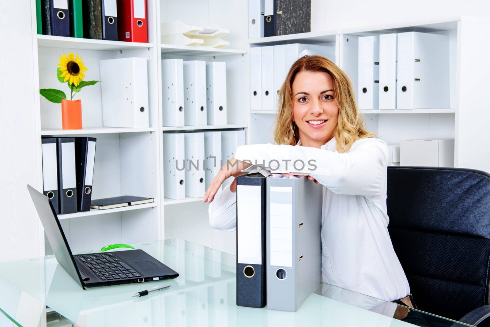 young blond businesswoman working in the office