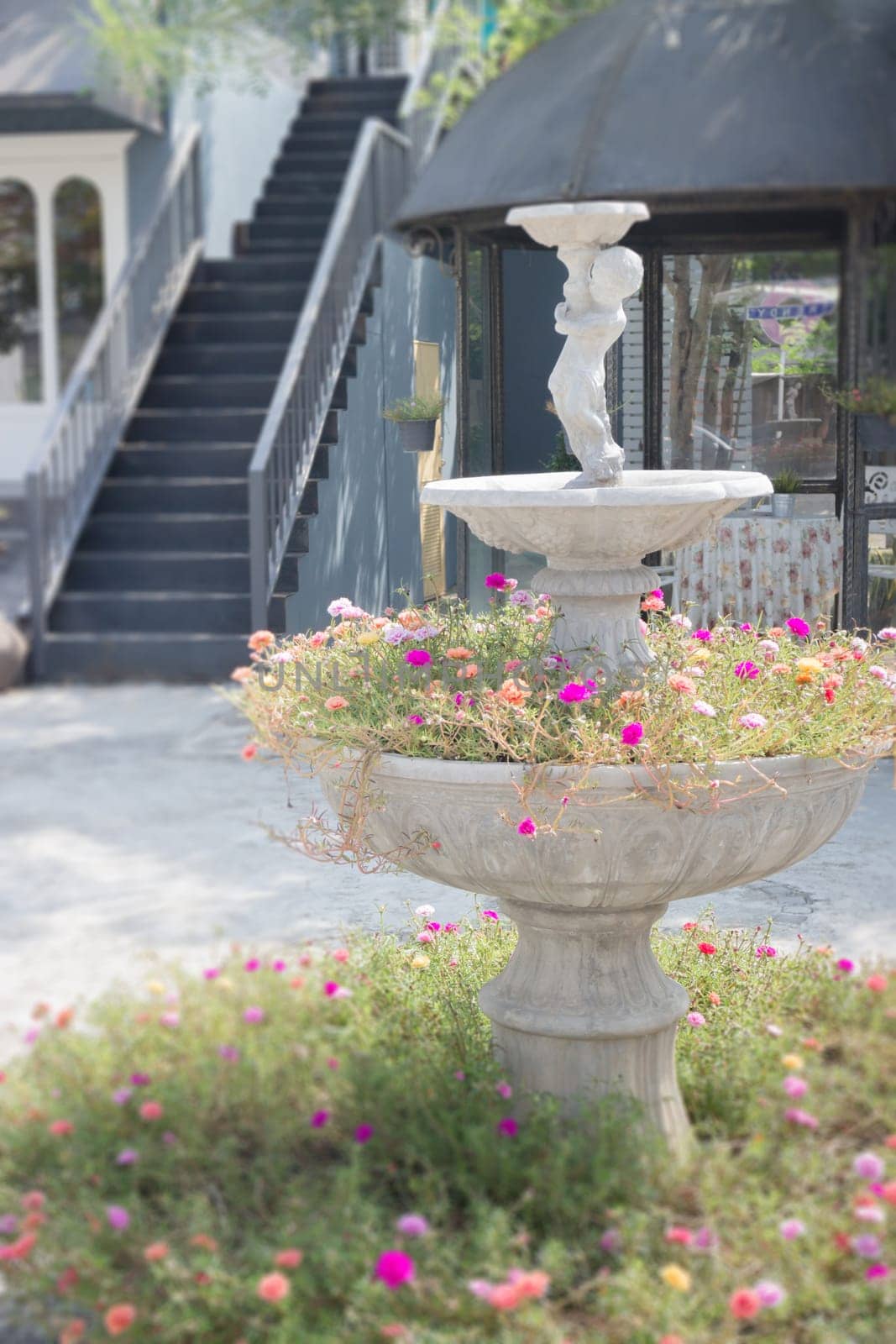 Cement garden ornament in summer, stock photo