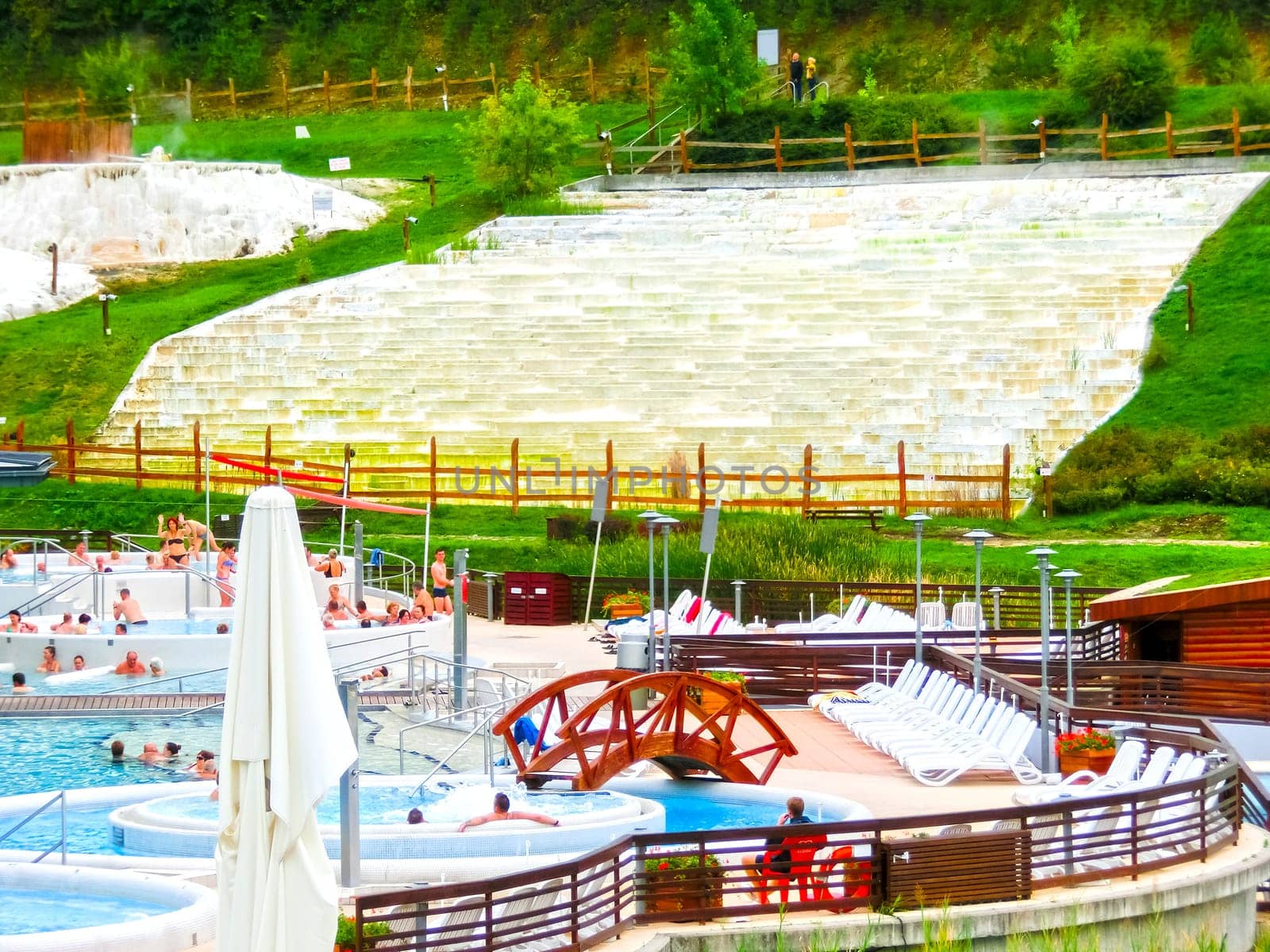 Egerszalok, Hungary - September 27, 2015: People resting in hot water pools of the Saliris resort. The Egerszalok spa pools contain water rich in calcium, magnesium, and hydrocarbonate minerals.