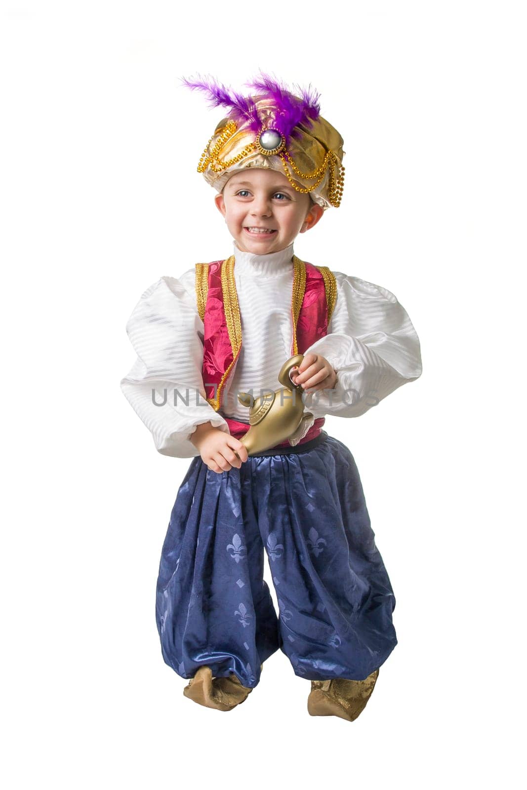 Child smilling in sultan costume with lamp .isolated.