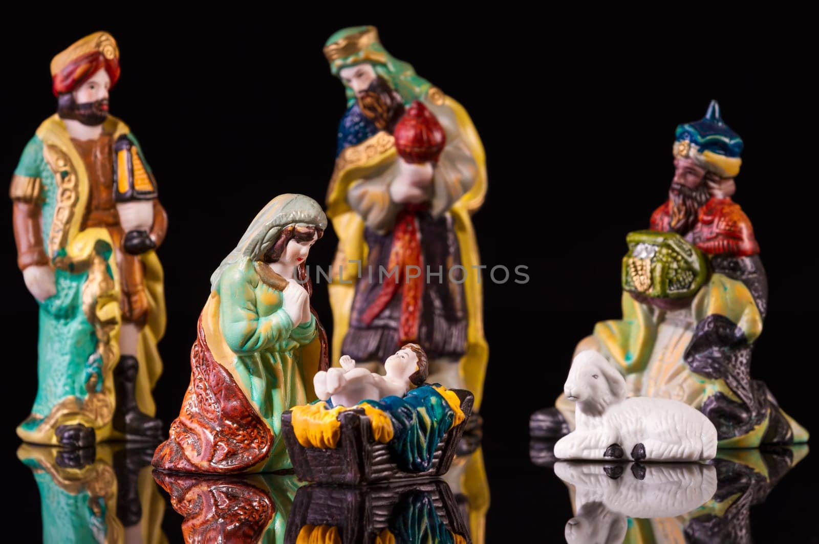 Christmas Manger scene with figurines including Jesus, Mary and magi. Focus on Mary!