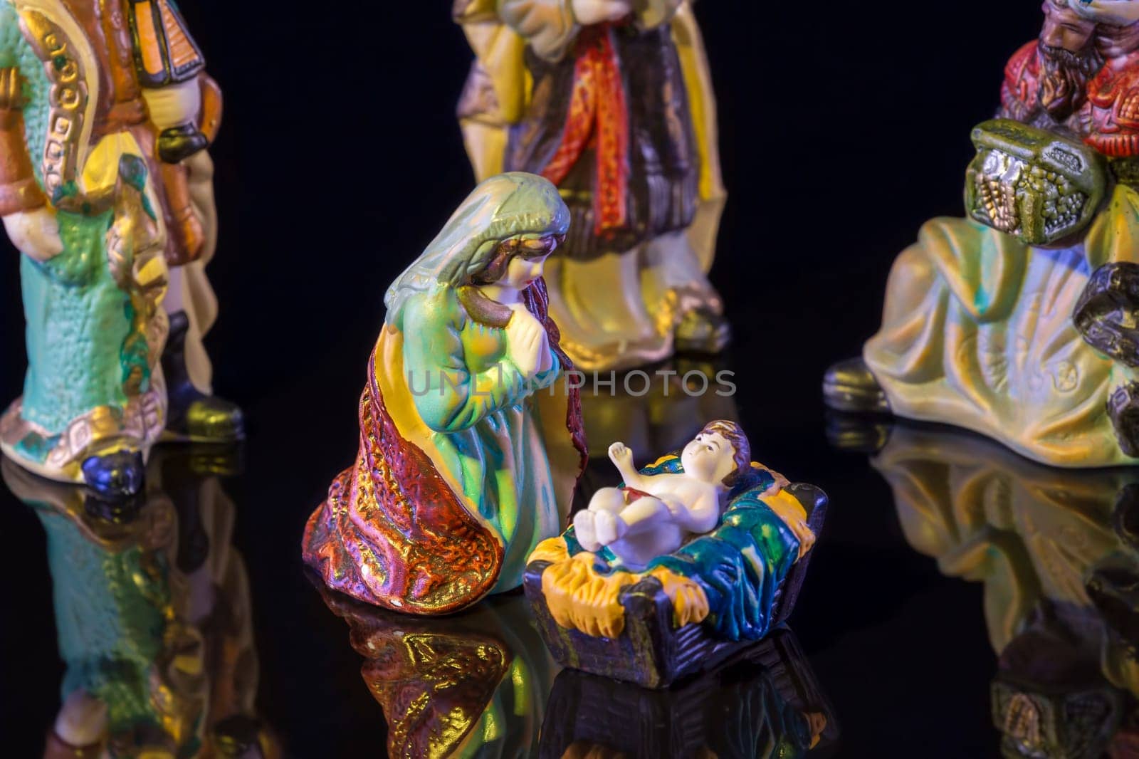 Christmas Manger scene with figurines including Jesus, Mary and magi. Focus on Mary!