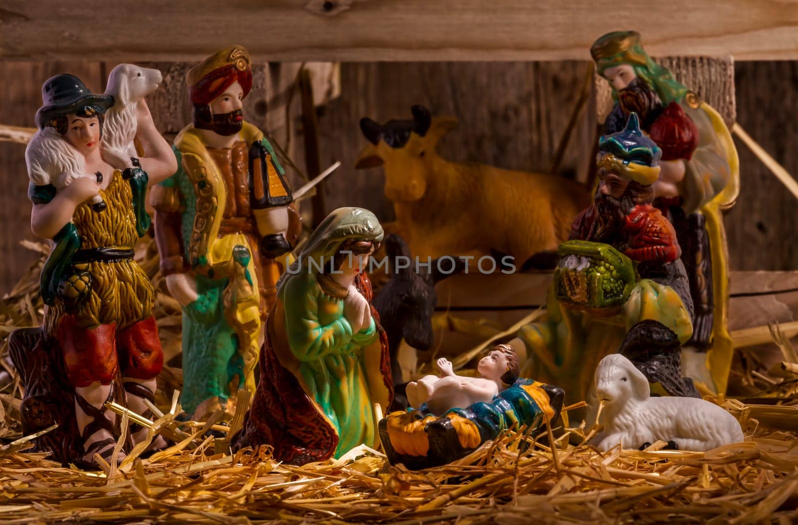nativity scene with hand-colored figures made out of wood. Focus on  Mary!