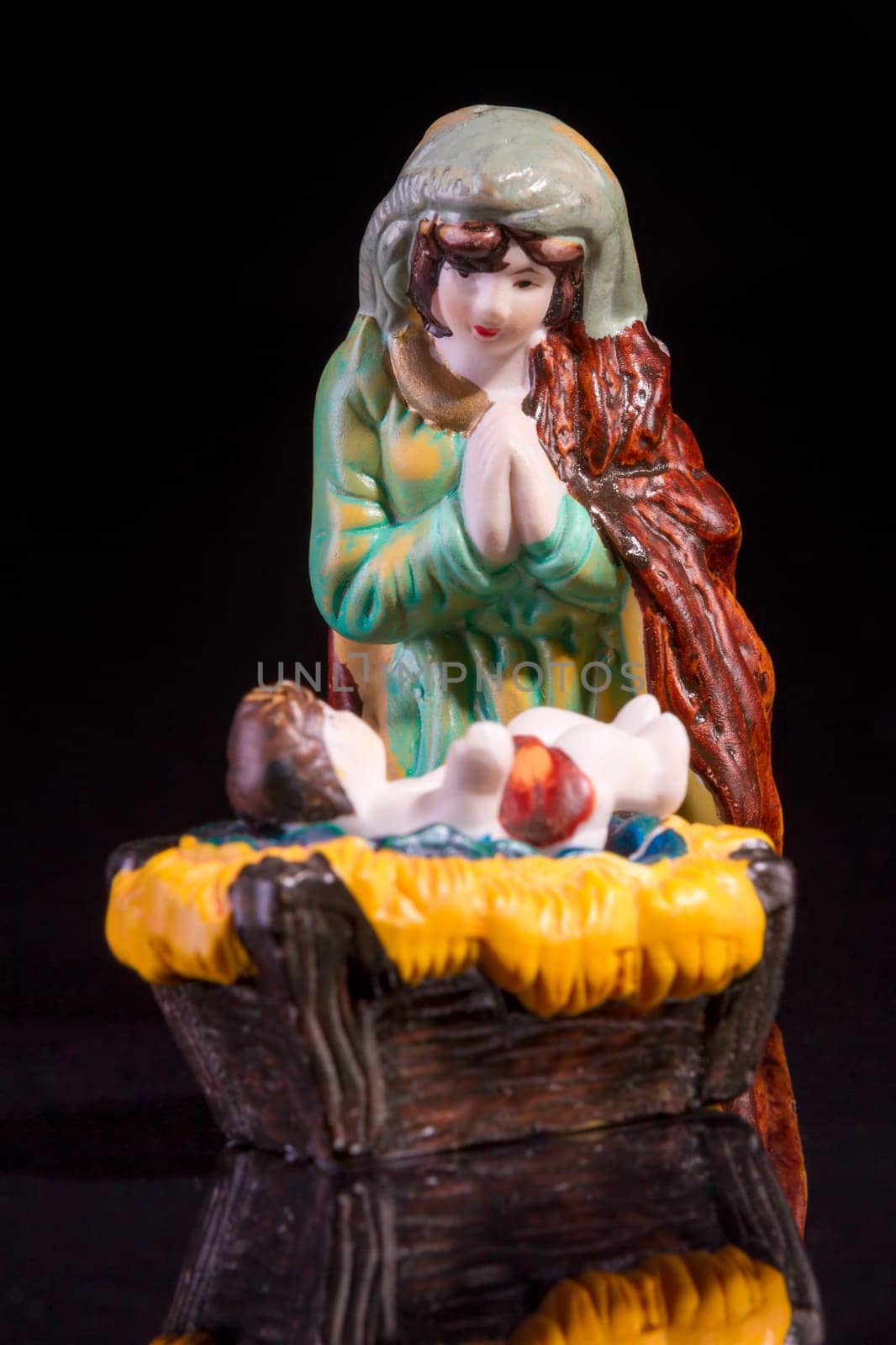 Christmas scene with Jesus and Mary on black background. Focus on Mary!
