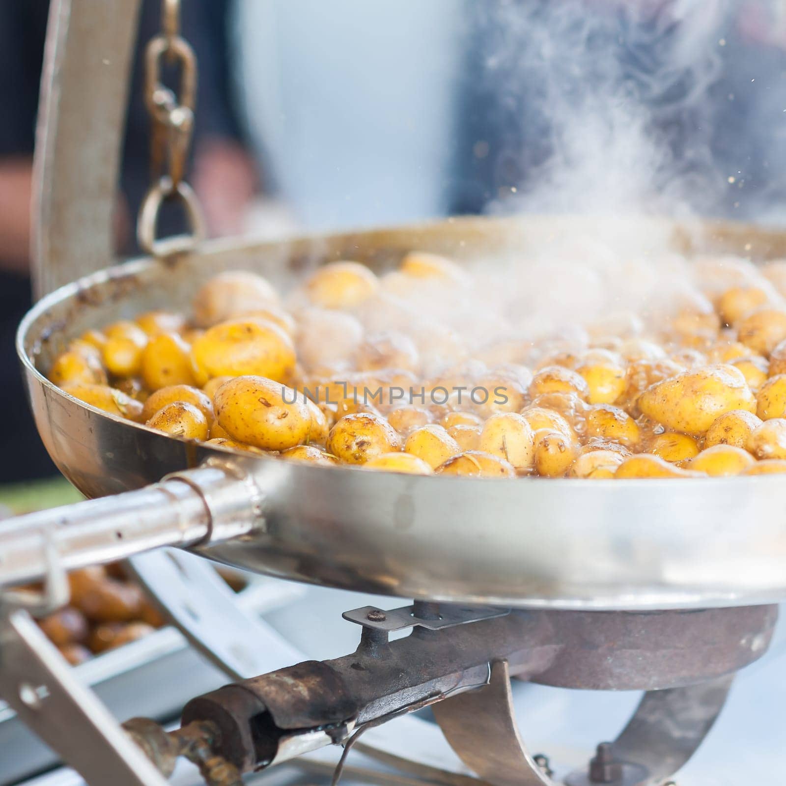 New potatoes. Fried in a pan. Italian recipe: potatoes cooked to Salento. Selective focus.