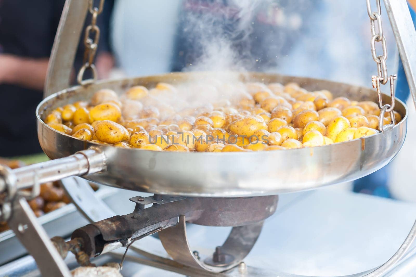 New potatoes. Fried in a pan. Italian recipe: potatoes cooked to Salento. Selective focus.