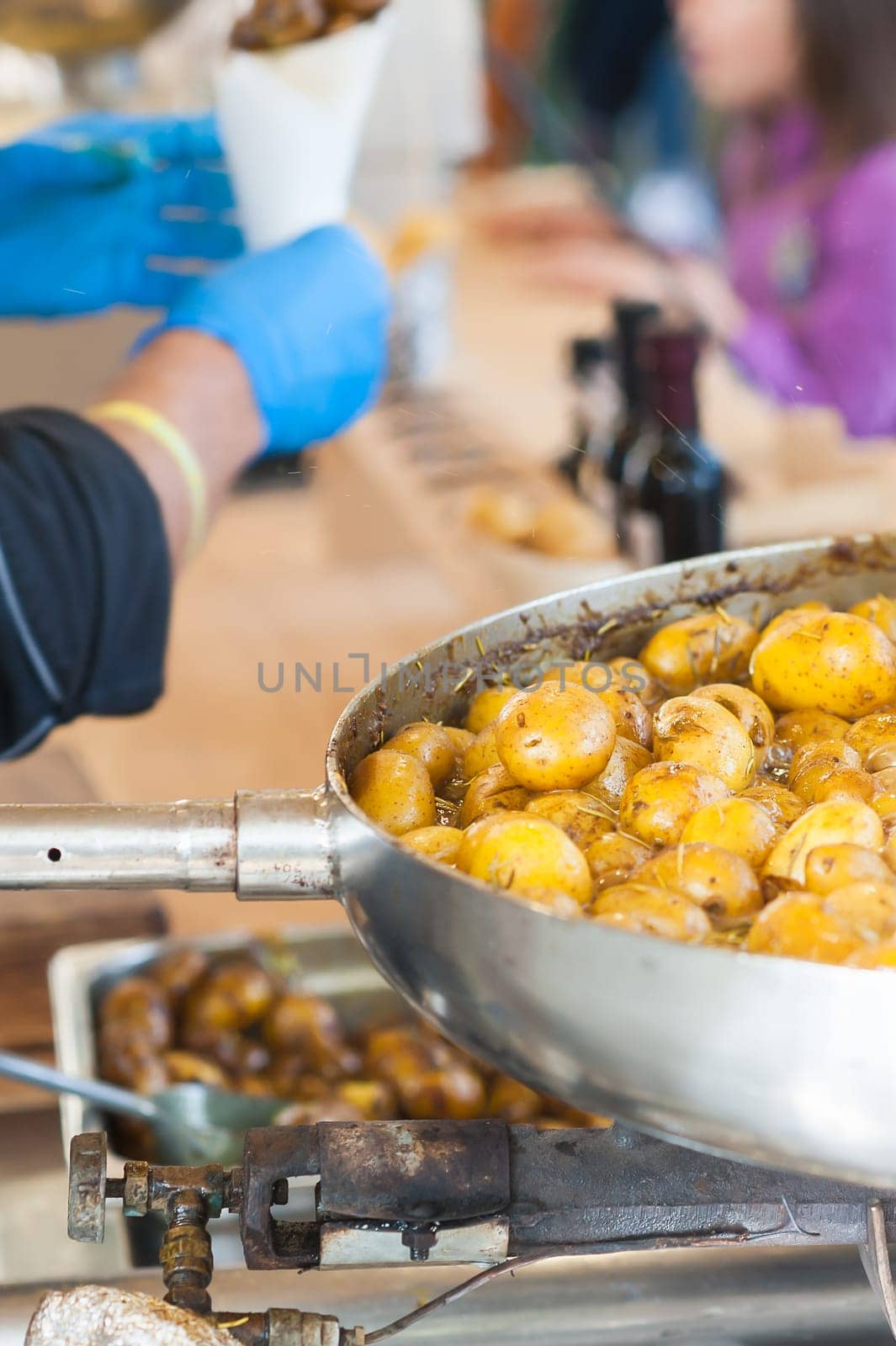 New potatoes. Fried in a pan. Italian recipe: potatoes cooked to Salento. Selective focus.