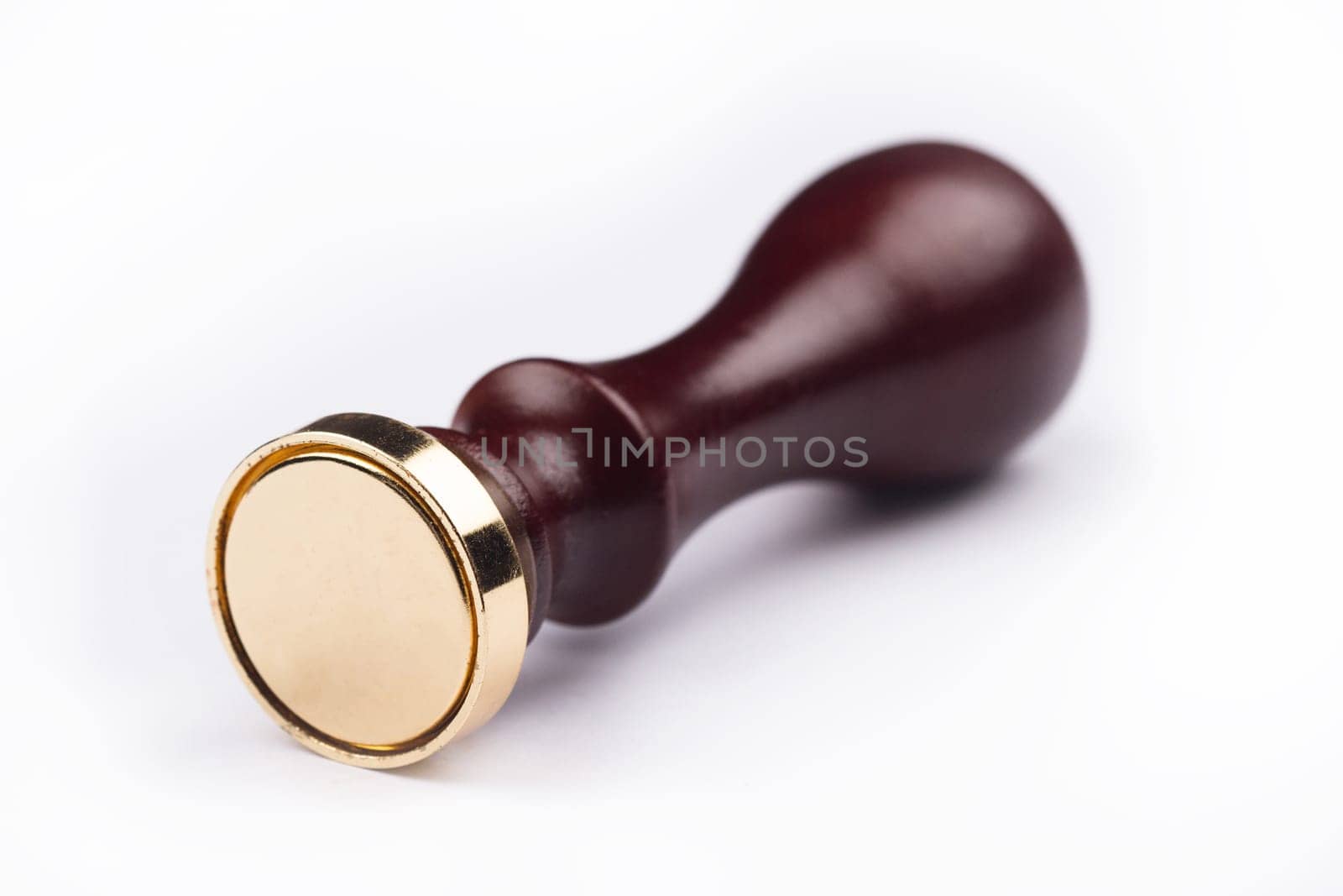 front view of personal stamp tool with wooden handle and metallic empty head isolated on white