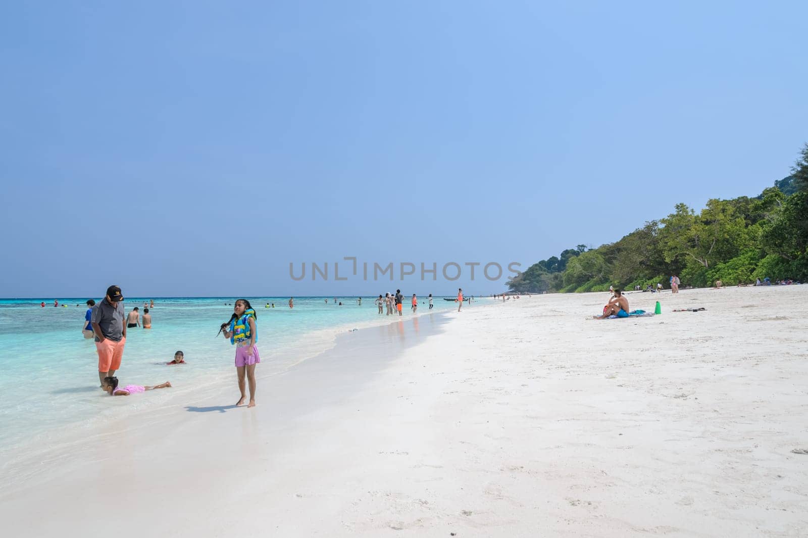 Phang Nga, Thailand-FEBRUARY 15, 2015 : Tourists at crystal clear water as emeral and white sand beach of Tachai island in Phang-nga, Thailand.