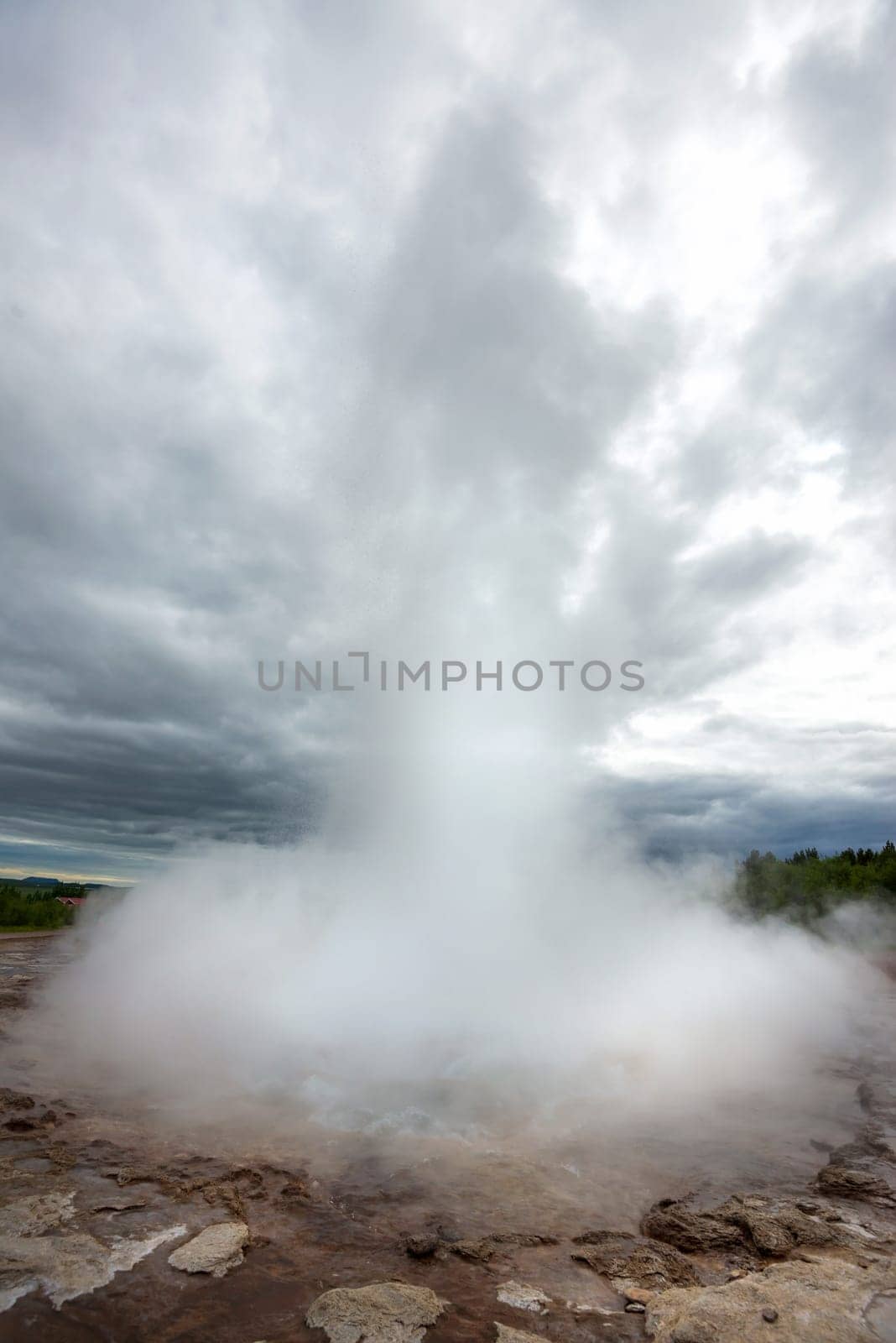 Strokkur geysir blowing high, Iceland in June