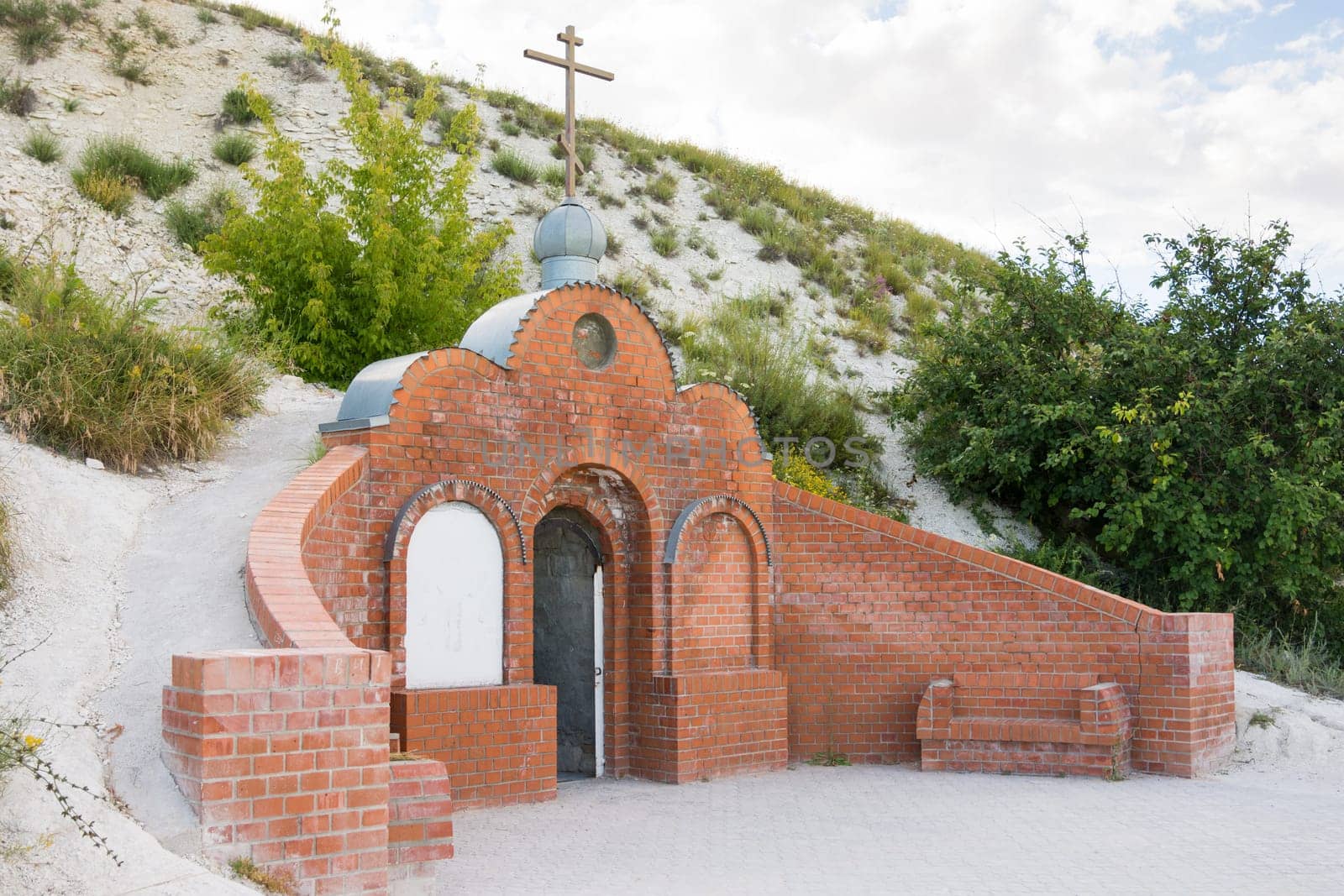 Olkhovka, Russia - July 10, 2016: Entrance to the cave monastery of Holy Trinity Stone-Brodsky Monastery in olkhovsky district of the Volgograd region, Russia