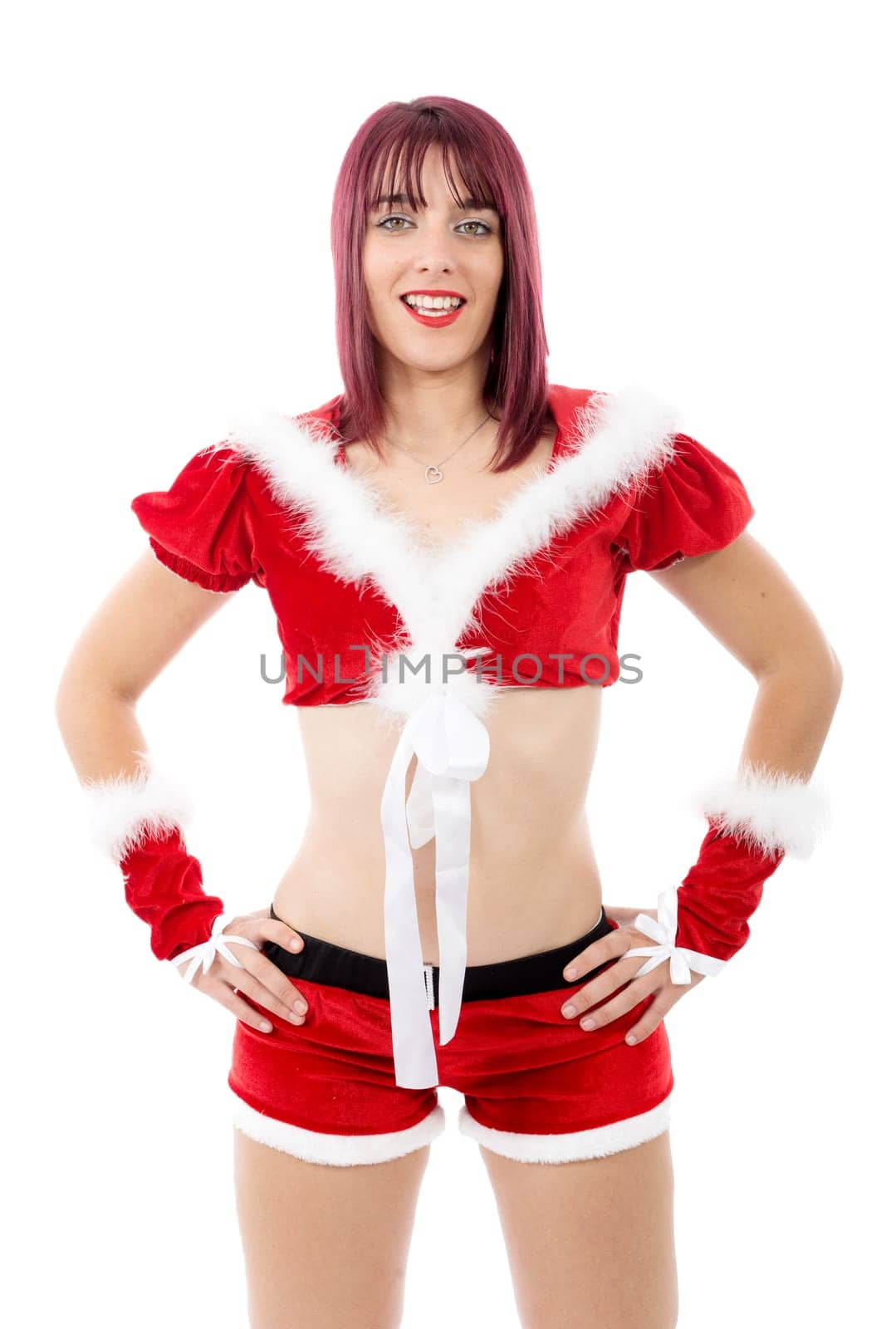 Beautiful sexy girl in Christmas costumes posing on a white background