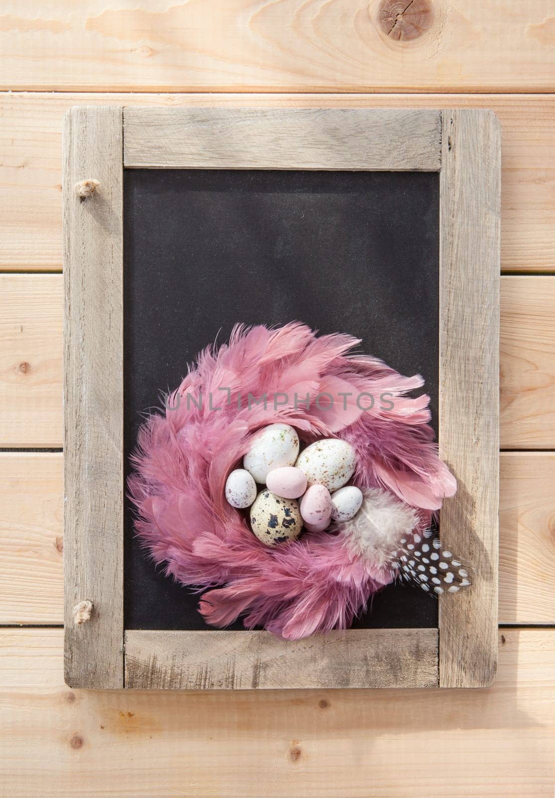 Rustic background at Easter with colorful Easter eggs