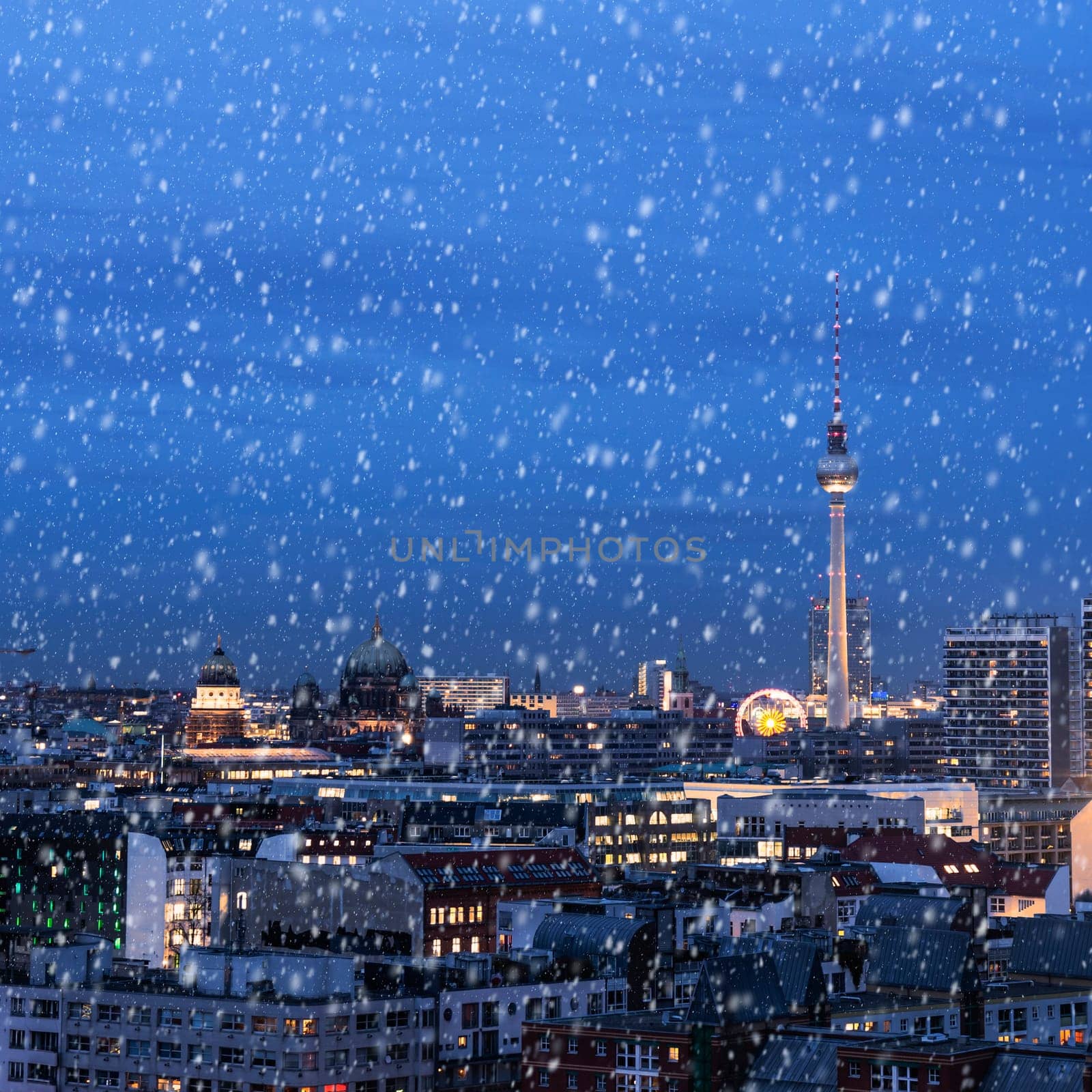 panoramic view on berlin in winter with snowflakes
