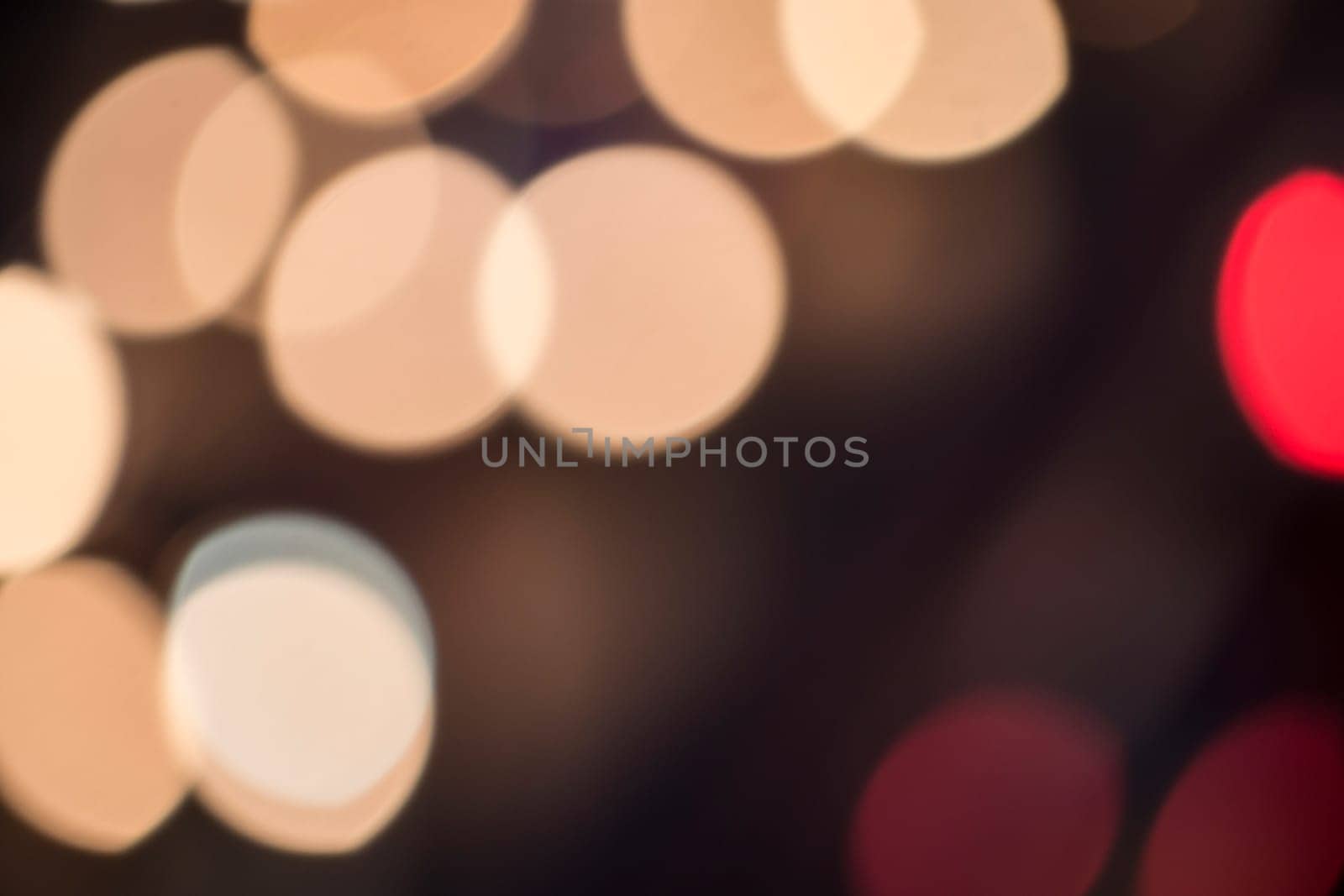 bokeh effect of cars on a highway by night