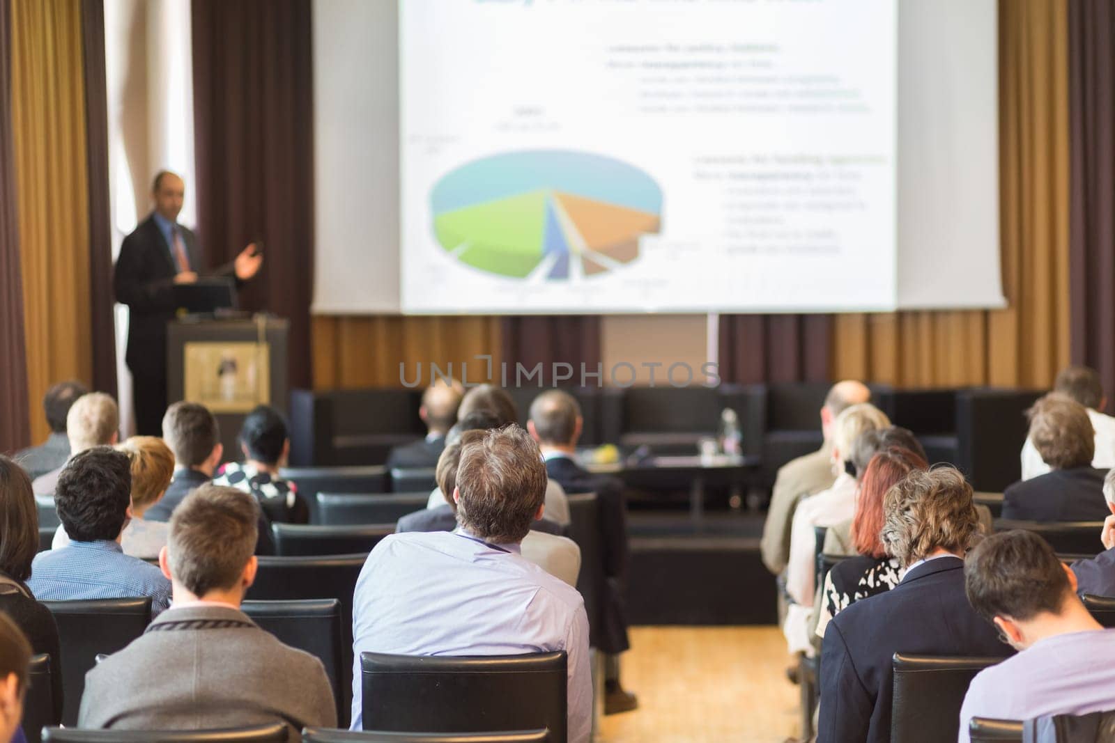 Speaker at Business Conference and Presentation. Audience in the conference hall. Business and Entrepreneurship.