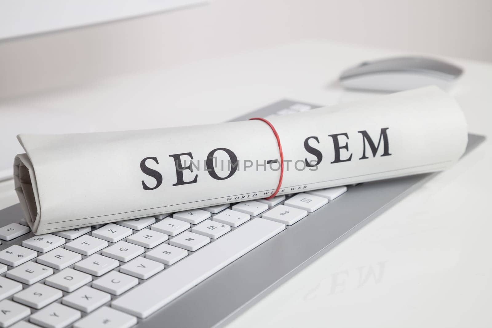 seo sem written on newspaper on computer keyboard