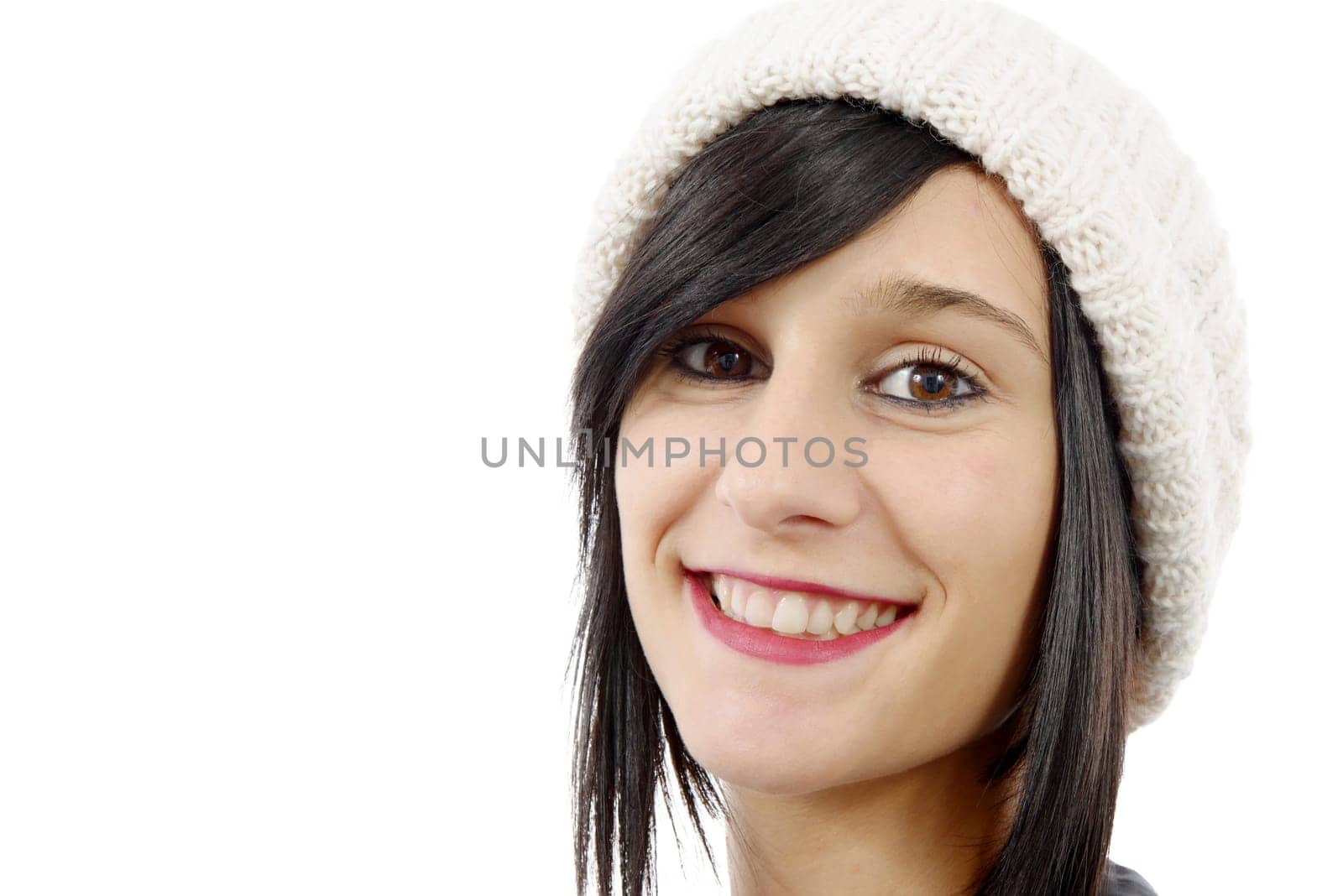 portrait of a pretty young brunette with winter hat isolated on white background