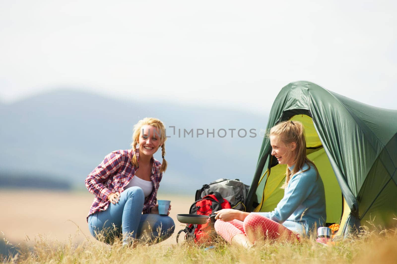 Two Teenage Girls On Camping Trip In Countryside