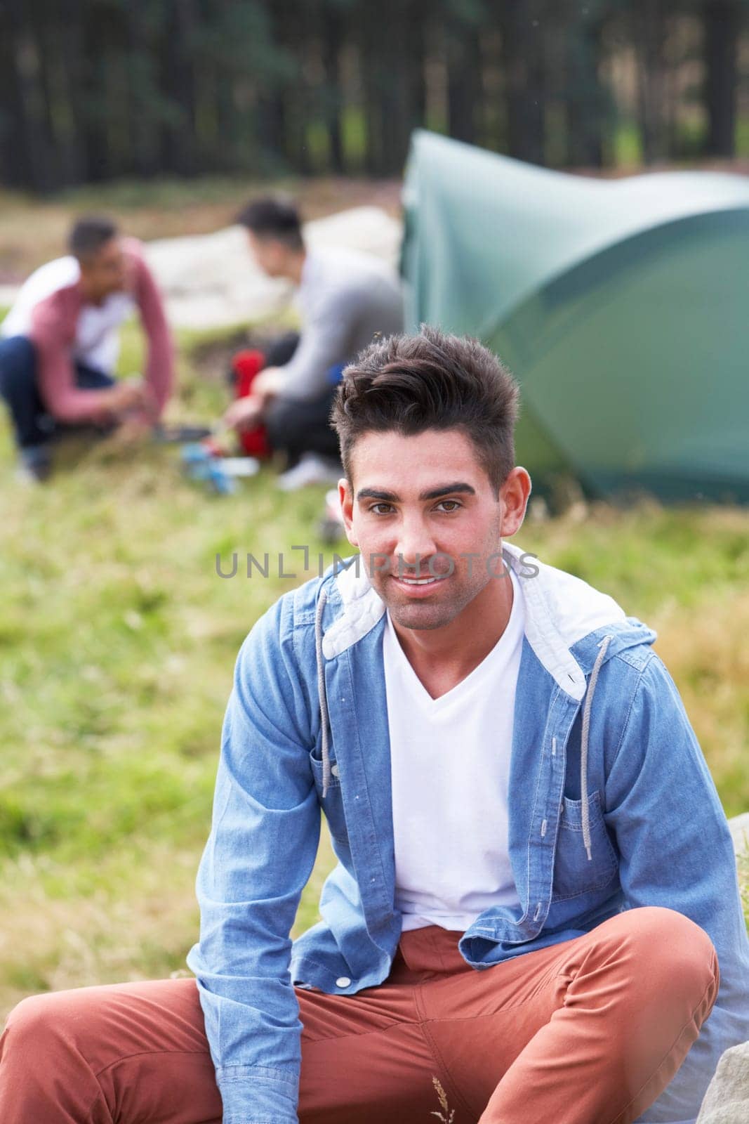 Group Of Young Men On Camping Trip In Countryside
