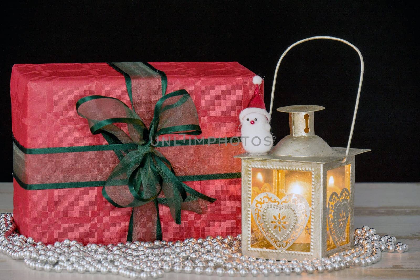 Christmas gifts and a old lantern with a candle