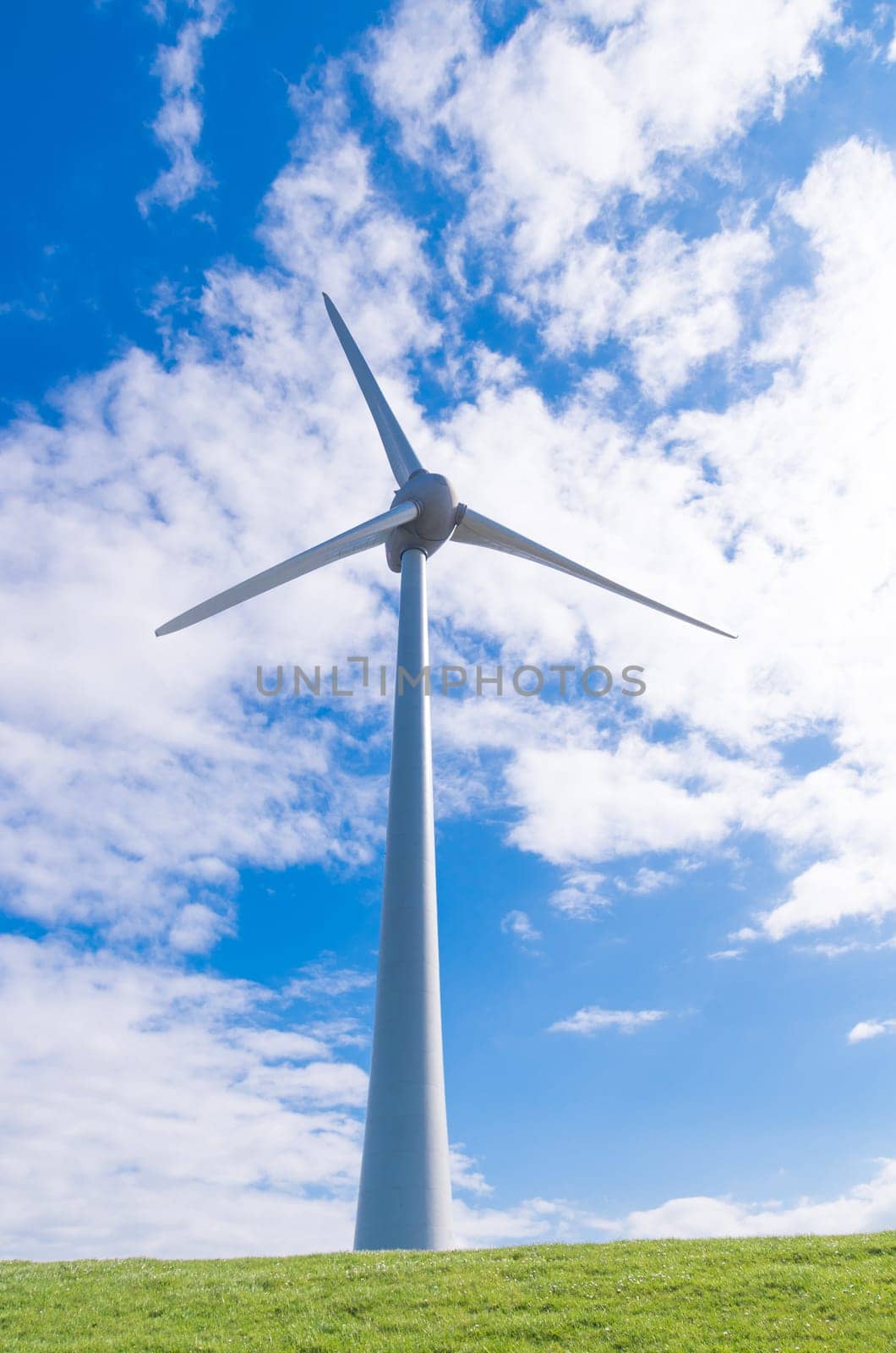 large wind turbine against a typical dutch sky
