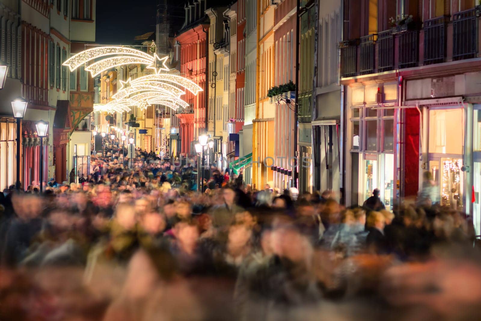 Large crowd of people hustling and shopping in a pedestrian area in Heidelberg,Germany,for Christmas