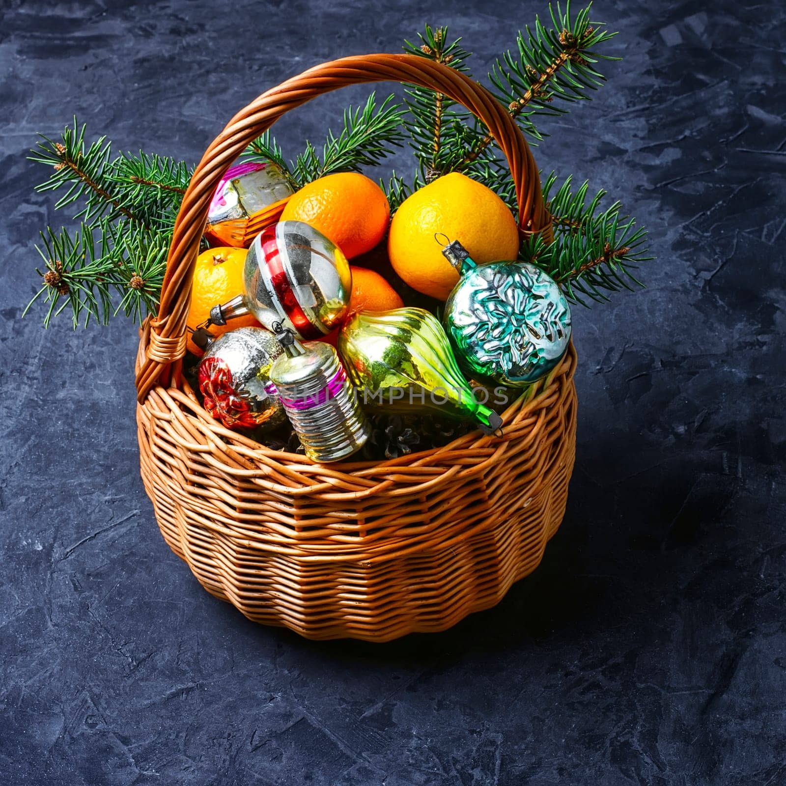 Wicker basket with vintage Christmas toys and gifts