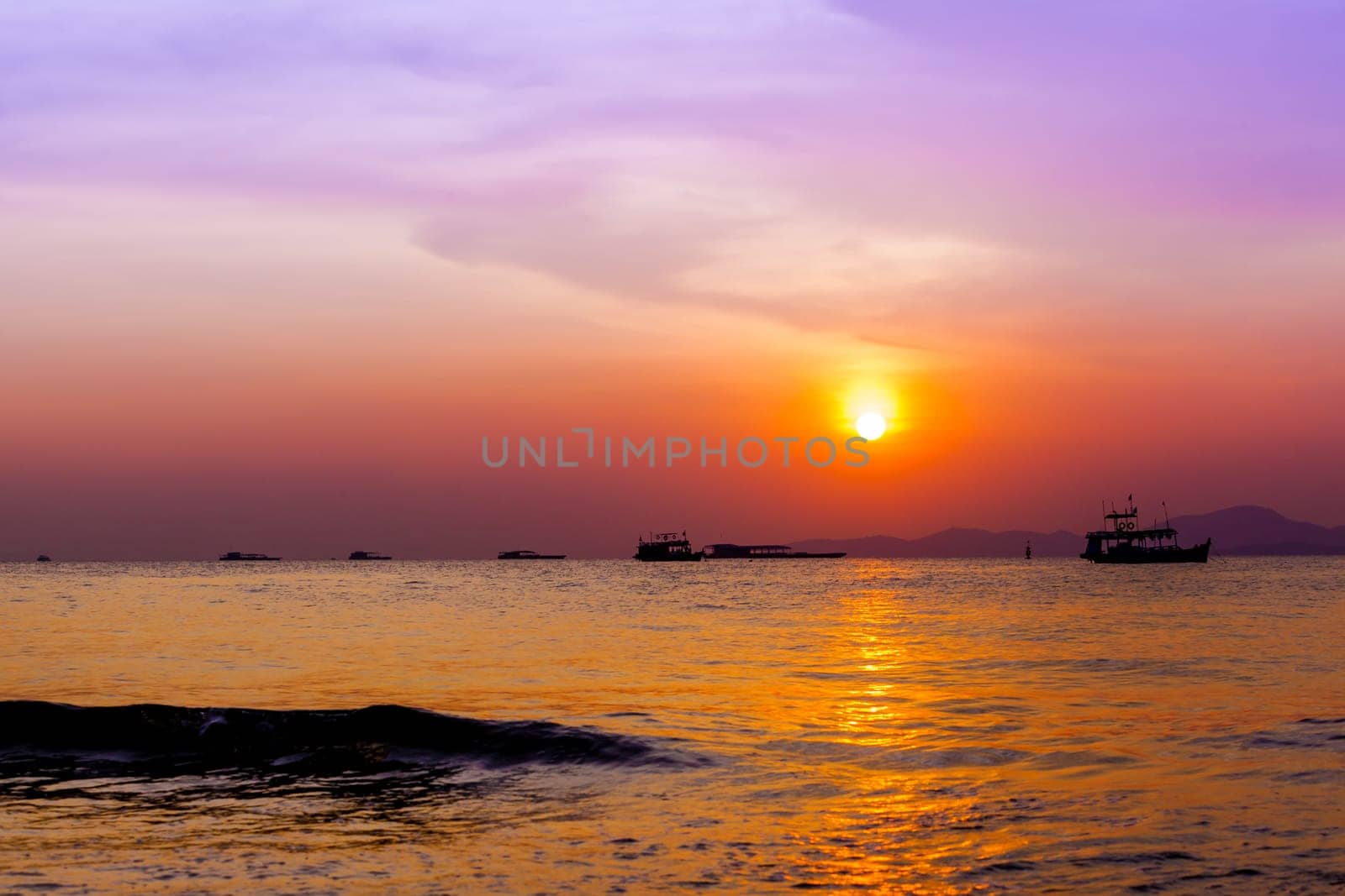 Beautiful landscape. sunset on the beach with fishing boat